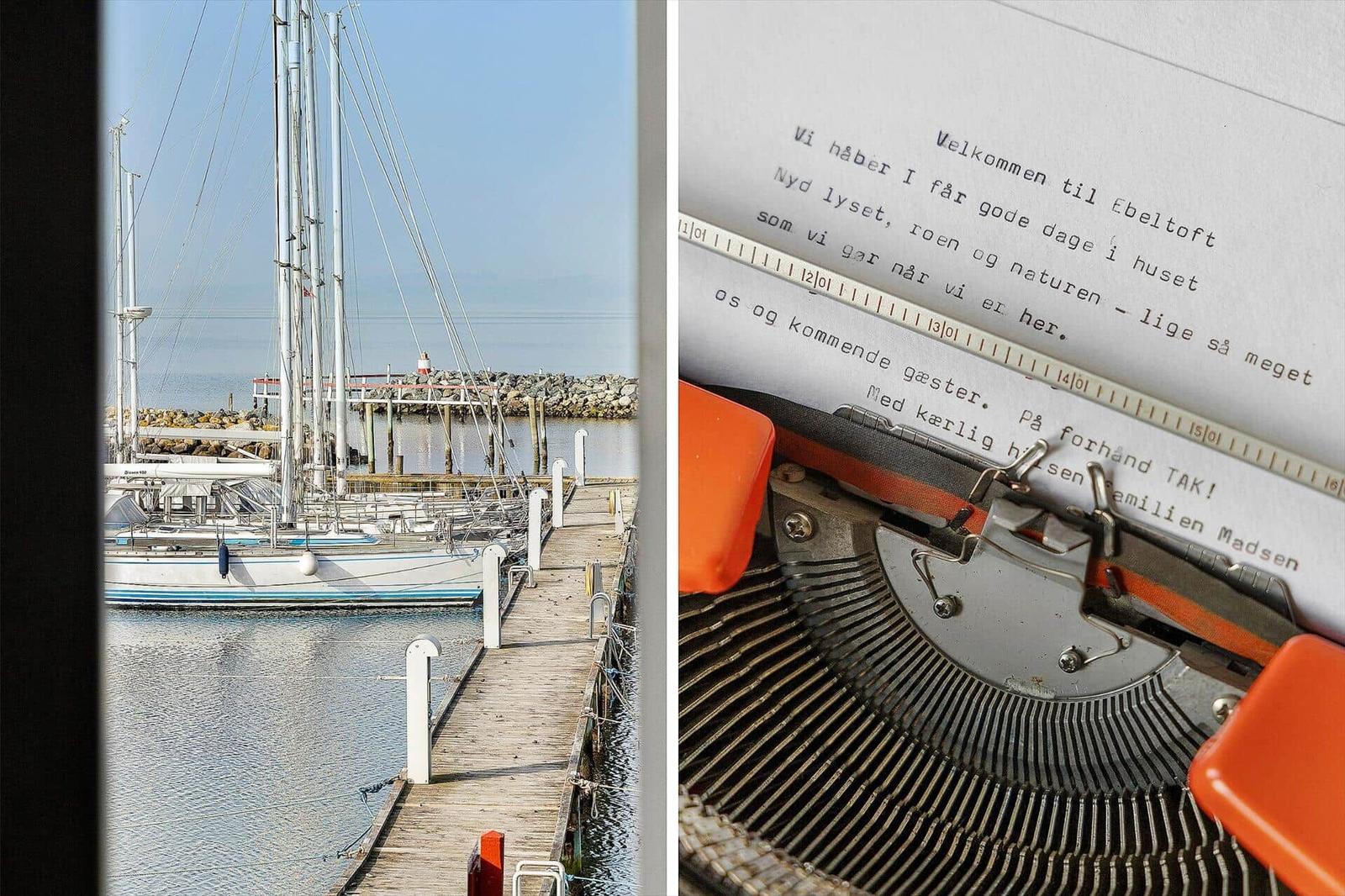 Harbor with sailboat and view of a typewriter with welcome text.