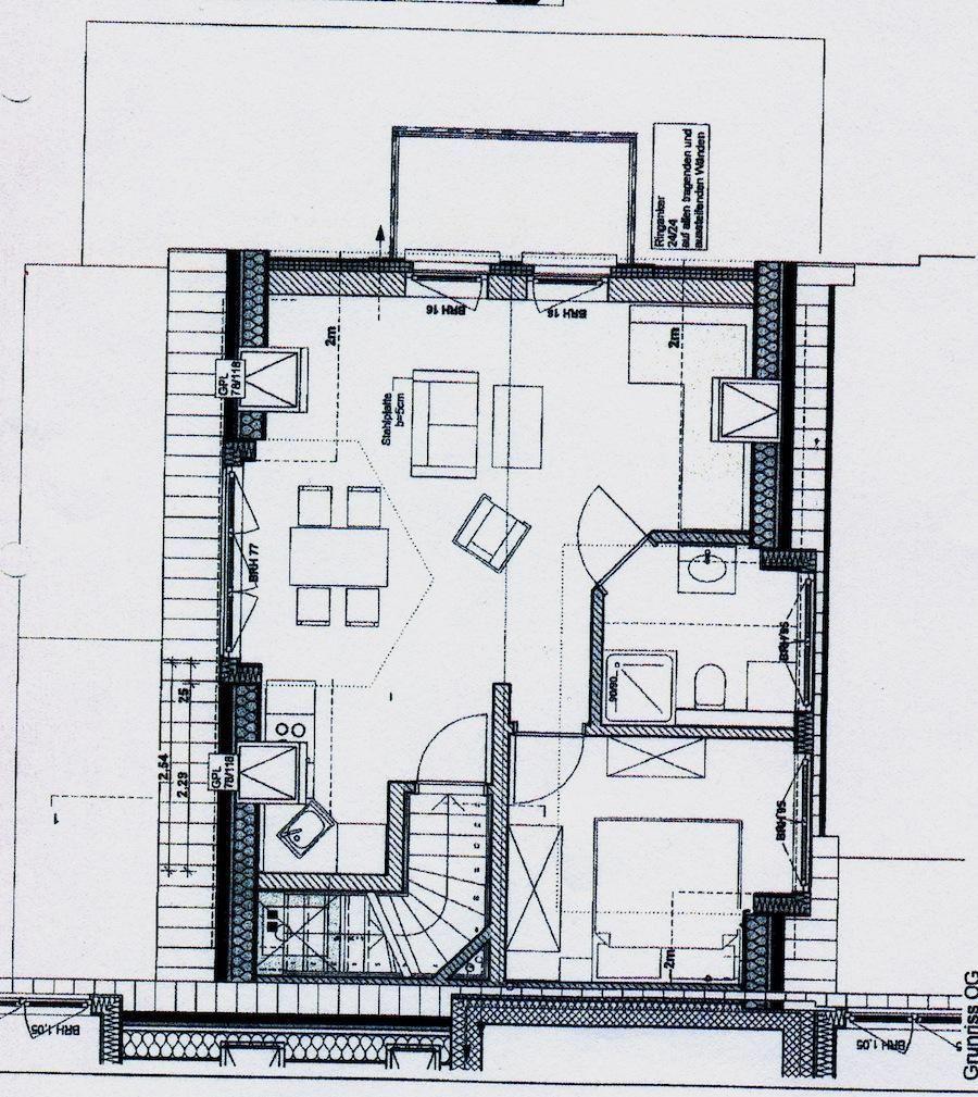 Grundriss einer Wohnung mit Küche, Essbereich, Schlafzimmer und Bad.