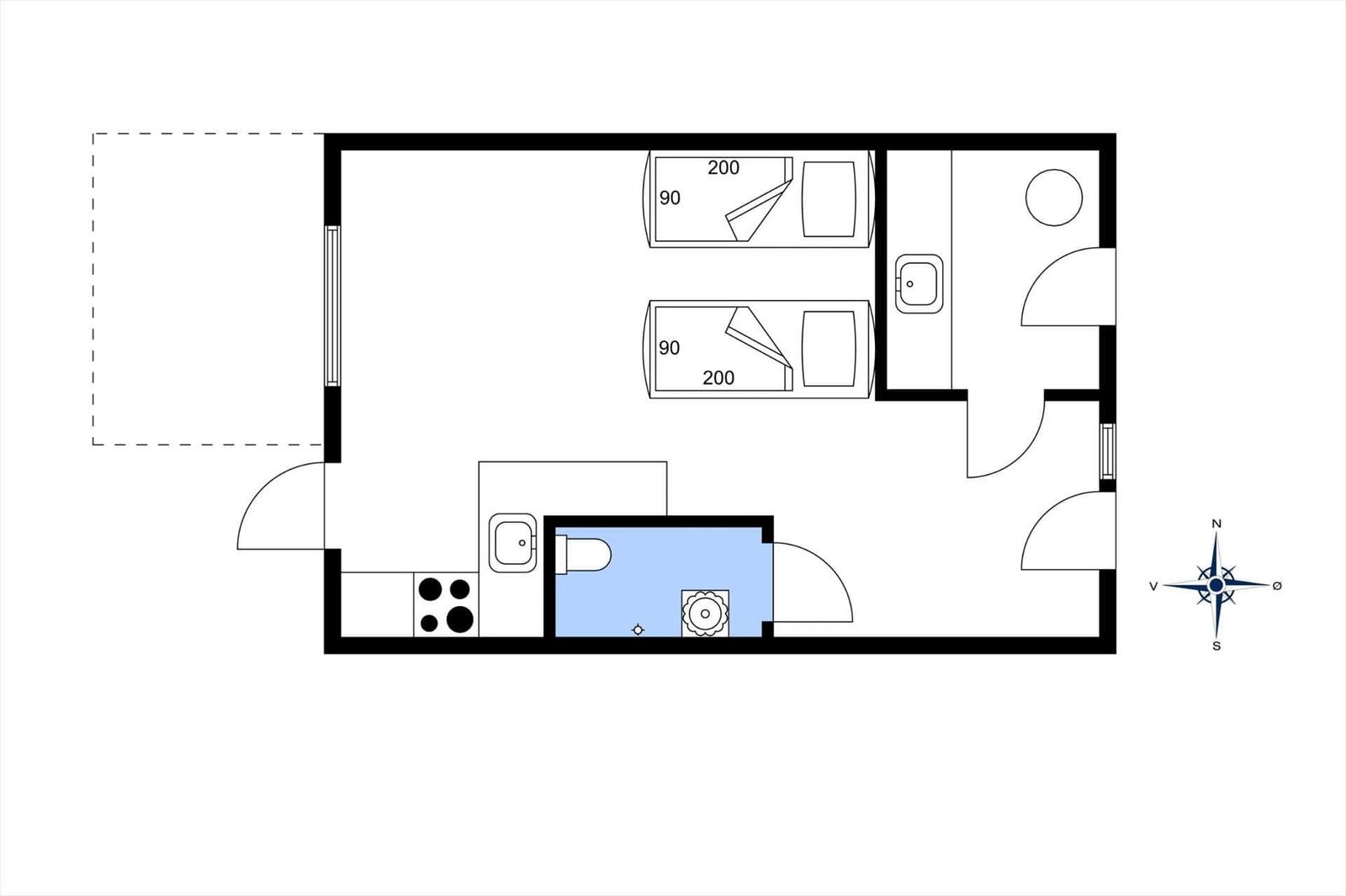 Two bedrooms, kitchen, bathroom, and toilet. Floor plan with compass.