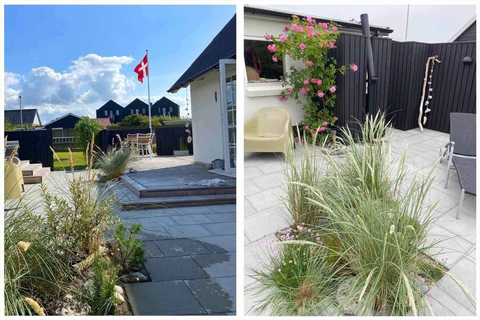 Terrasse mit Garten, Flagge und Sitzgelegenheiten. Rosen und Gräser schmücken den Außenbereich.