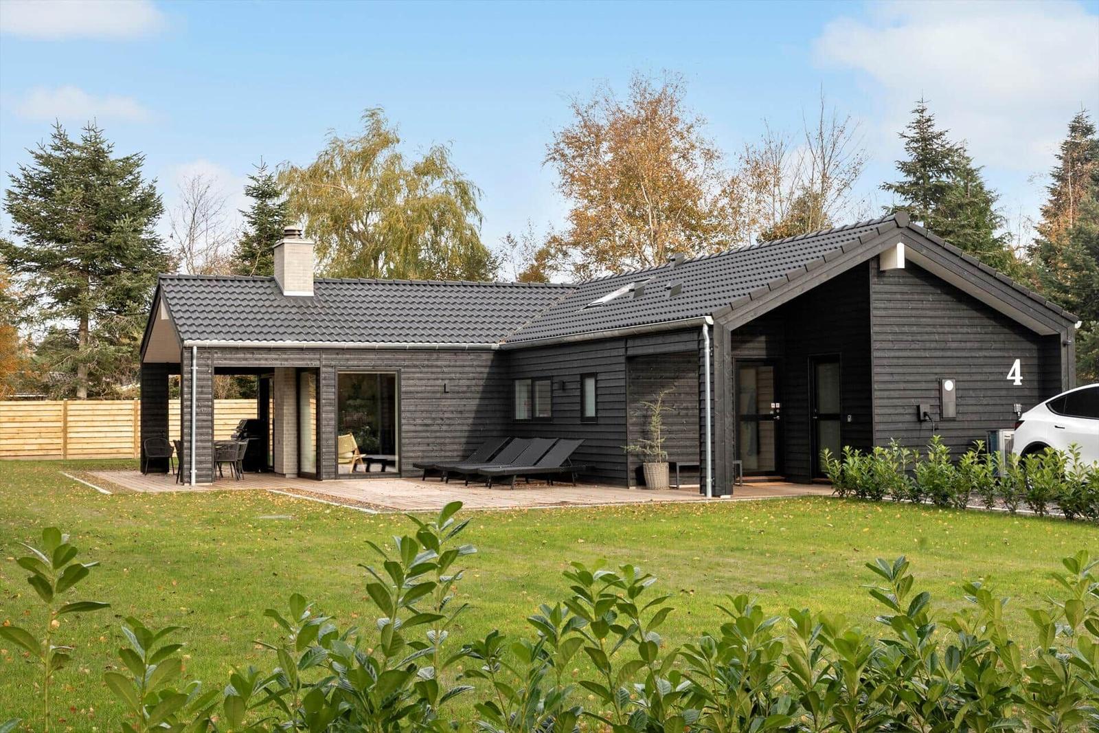 Modern house with terrace, garden, and loungers. Number 4.
