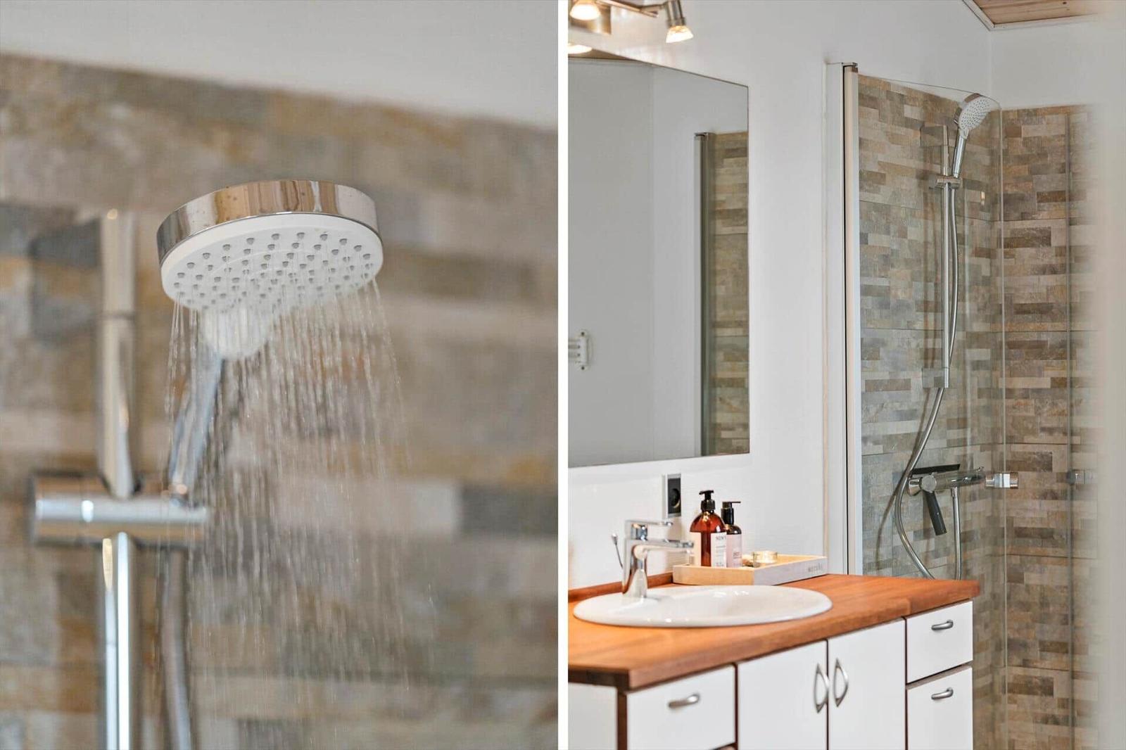 Bathroom with shower and sink with wooden countertop