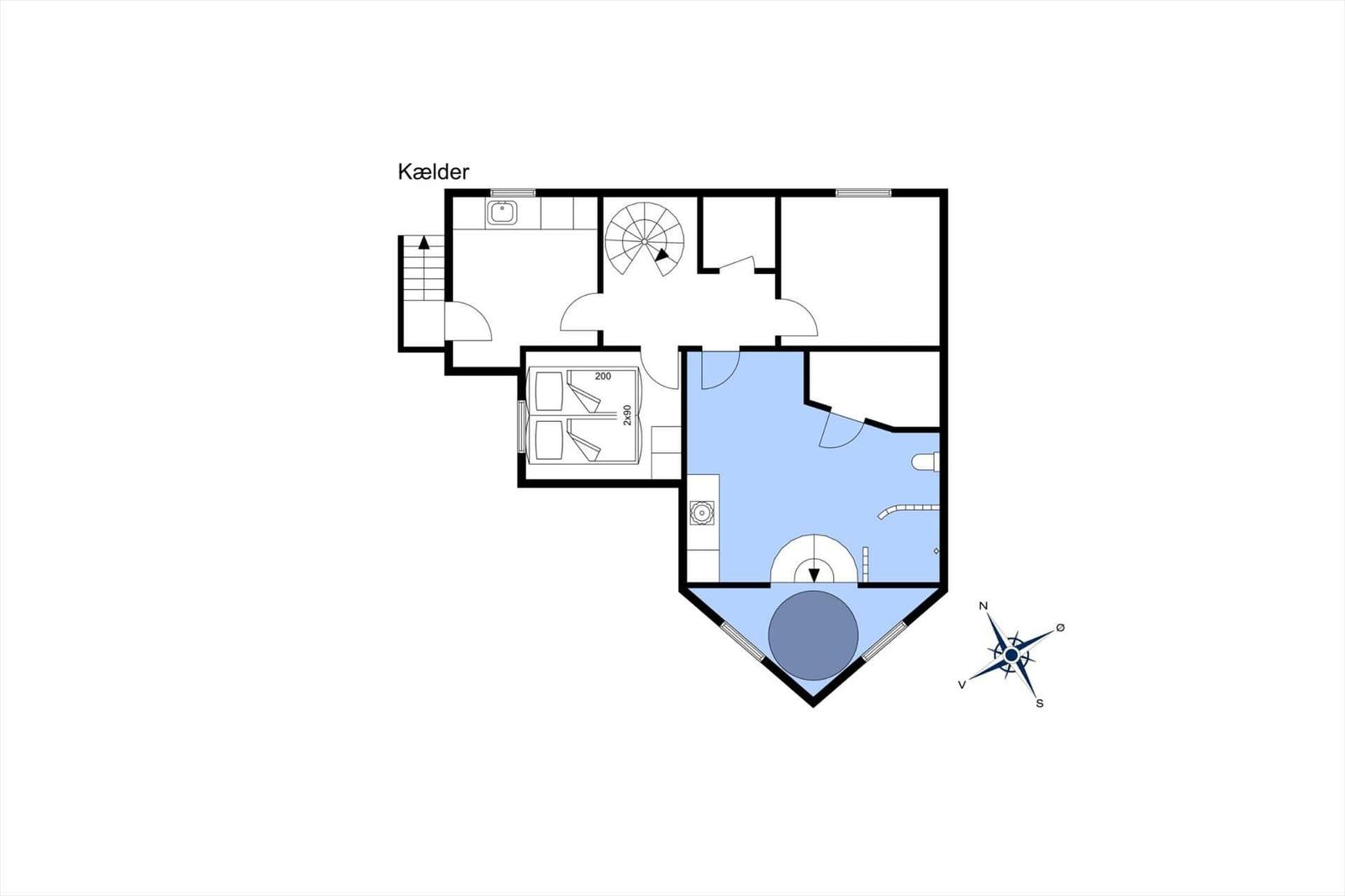 Basement with bathroom, stairs, and living area with bathroom and kitchen.