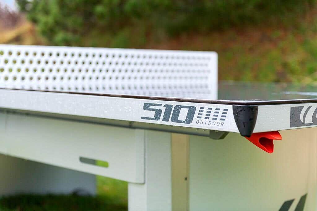 Outdoor table marked 510 Outdoor with perforated tabletop.