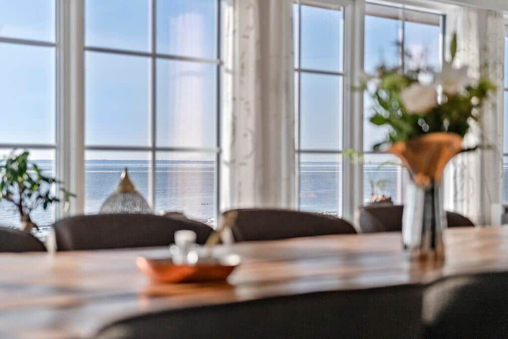 Dining room with water view and large windows