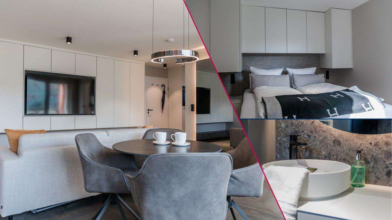 Modern eingerichtetes Apartment mit Wohnzimmer, Schlafzimmer und Bad. Große Flächen und klare Linien.