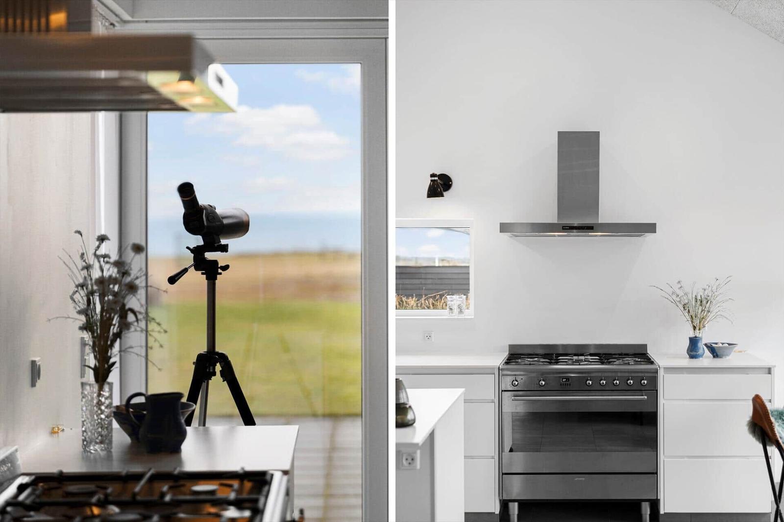 Kitchen with gas stove and view of field. Telescope on tripod.