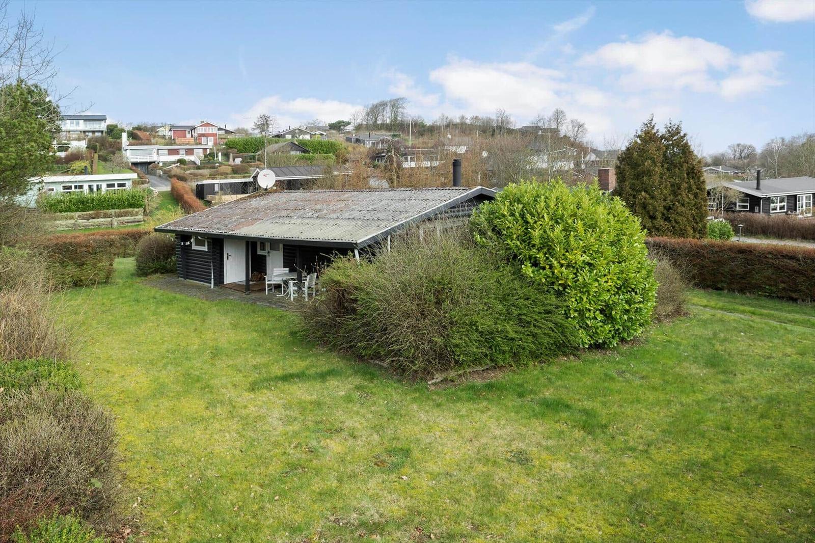 House with garden and terrace. View of surrounding houses.