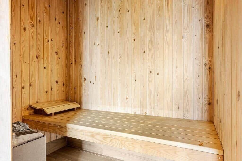 Sauna with wooden walls and bench