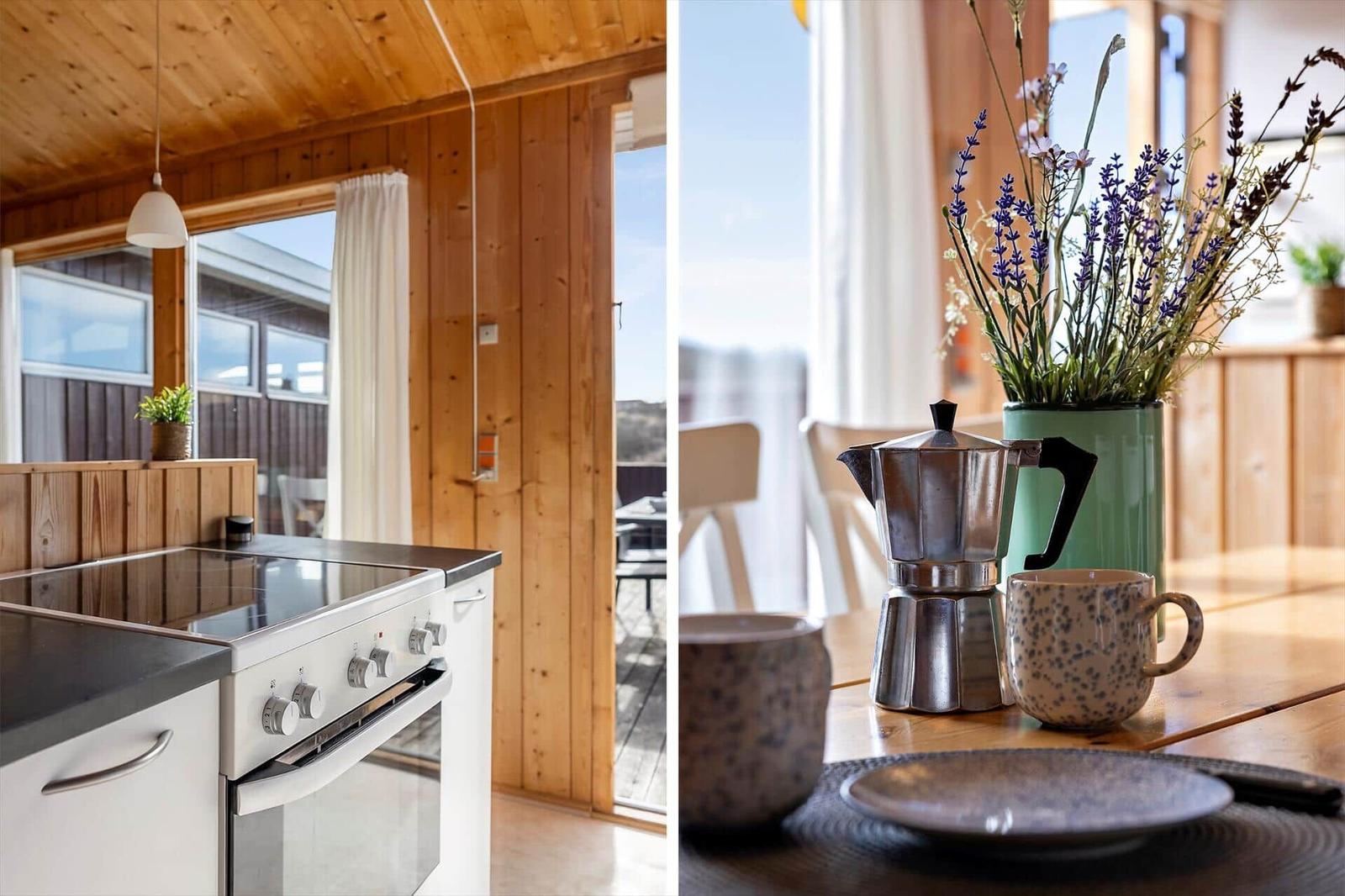 Kitchen with wooden walls and dining area with lavender and coffee maker.