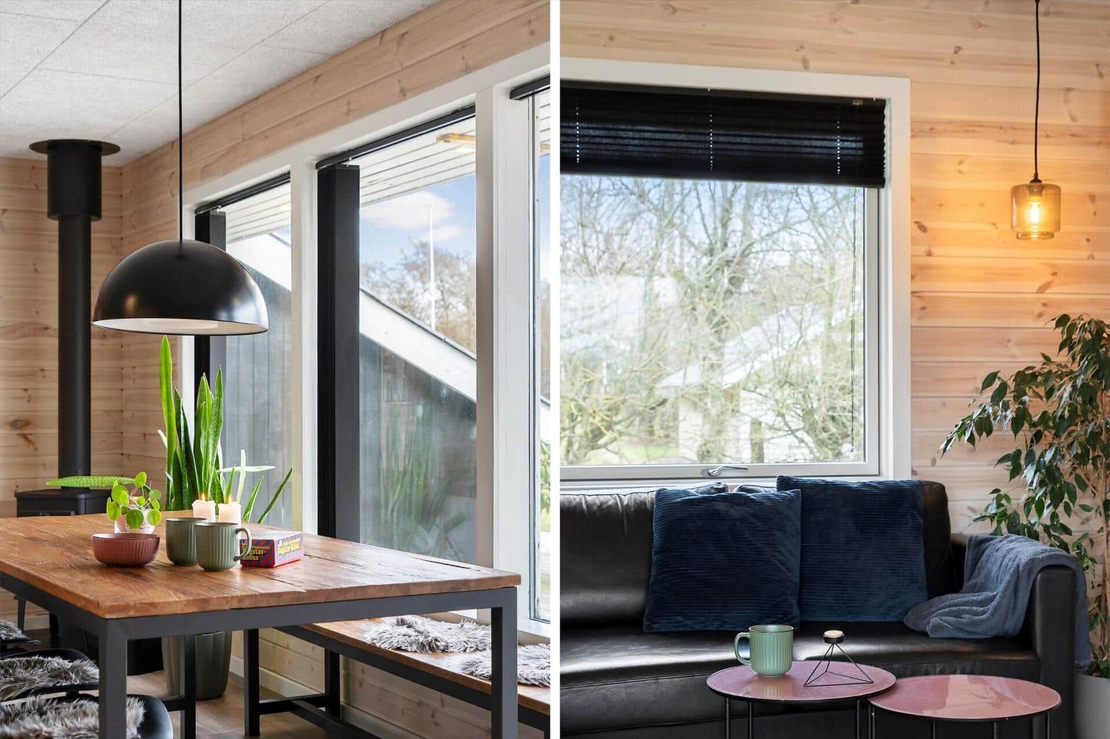Essbereich mit Holztisch und Fenster. Wohnbereich mit Sofa und Fenster.