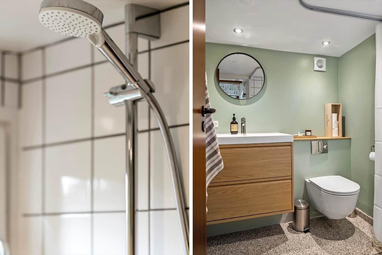 Bad mit Dusche und Waschbecken mit Spiegel