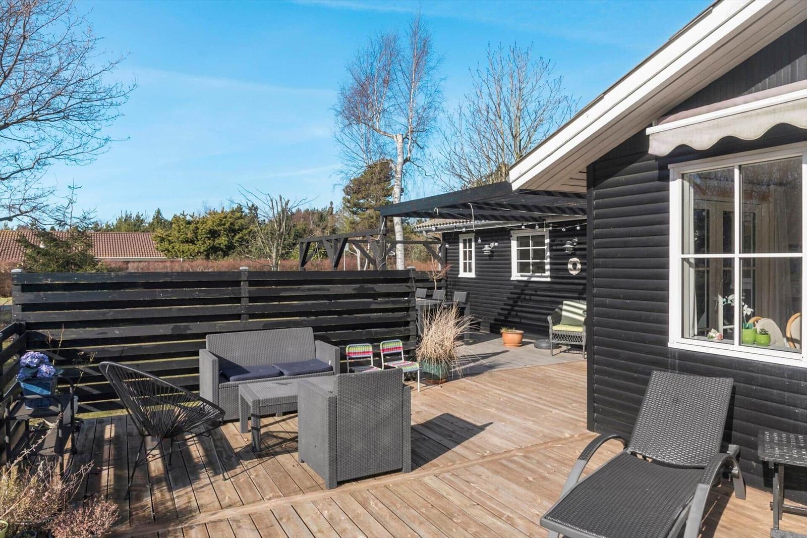 Terrace with garden furniture and view of the surroundings.