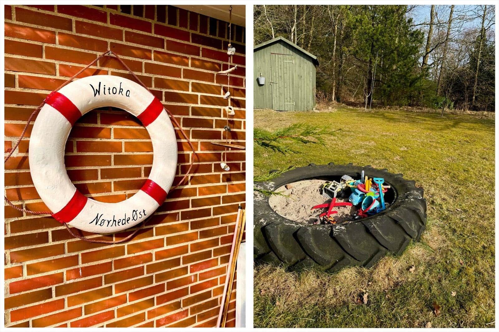 Rettungsring an Backsteinwand und Sandkasten mit Reifen im Garten