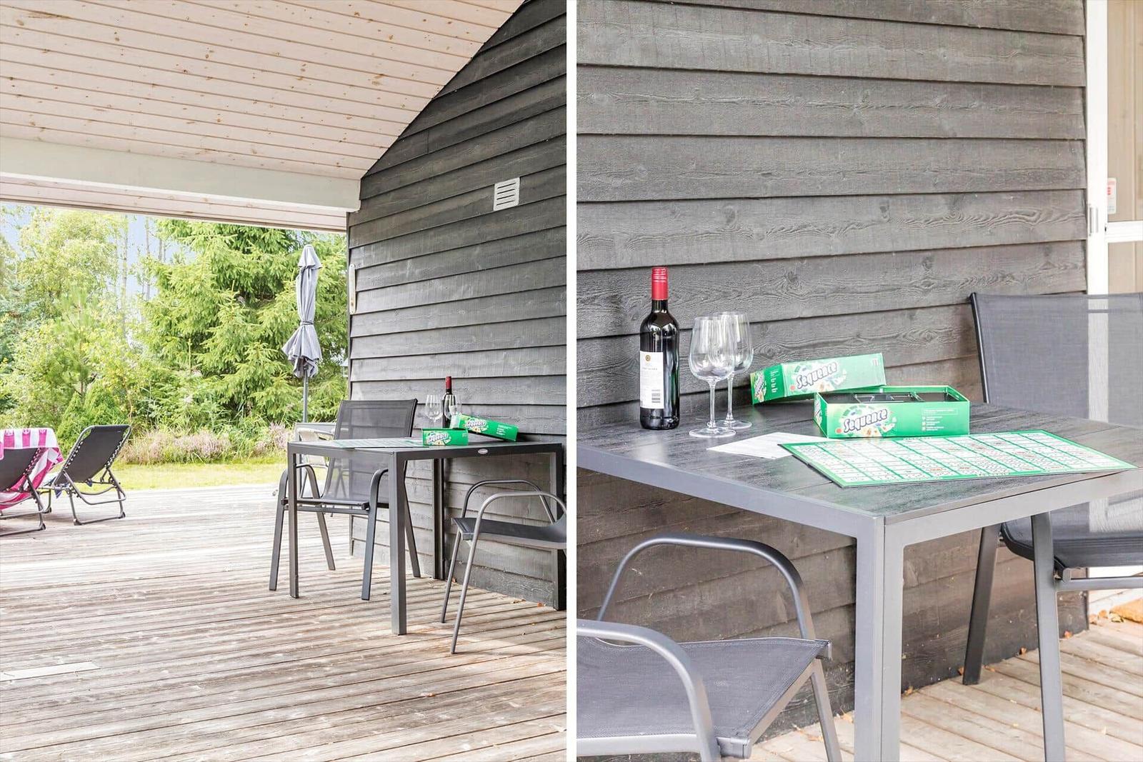 Terrace with table, chairs, and game. Background: forest and garden.