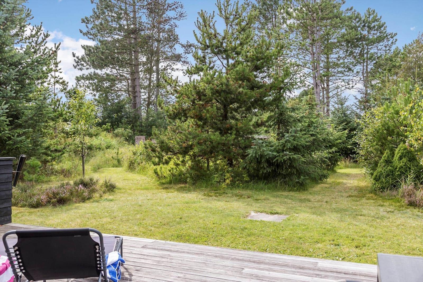 Deck with garden and trees in the background