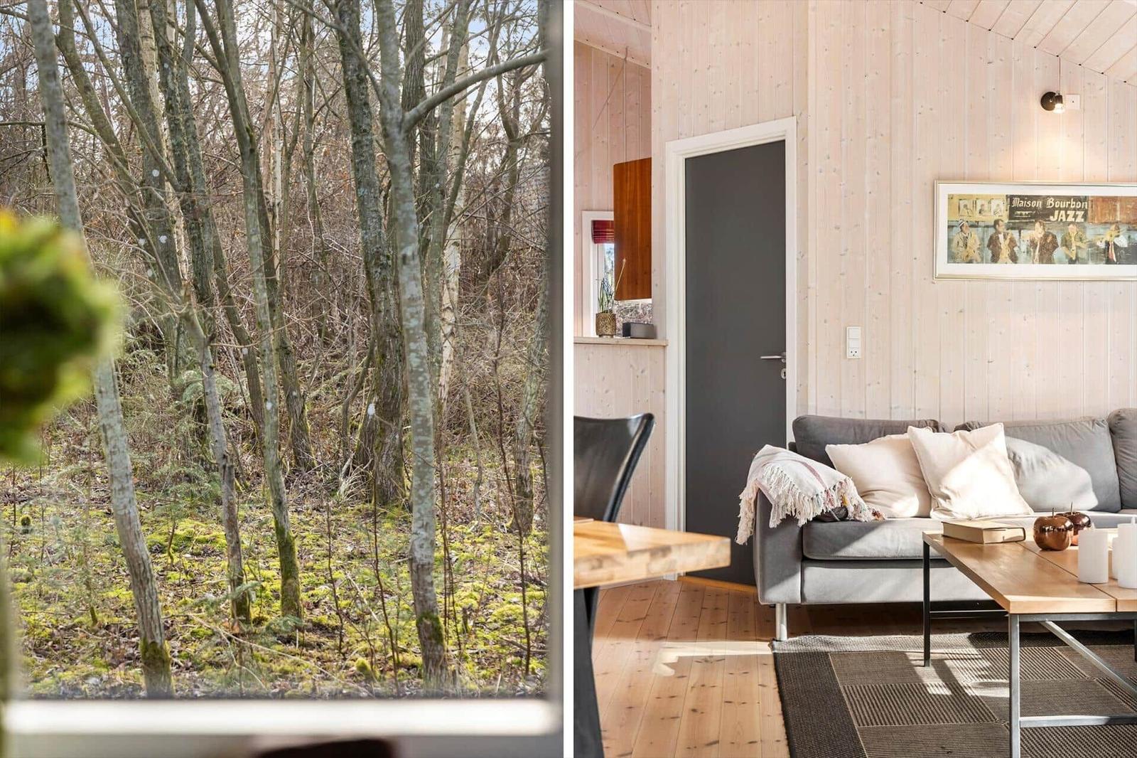 Wohnung mit Holzwand und Blick in den Wald