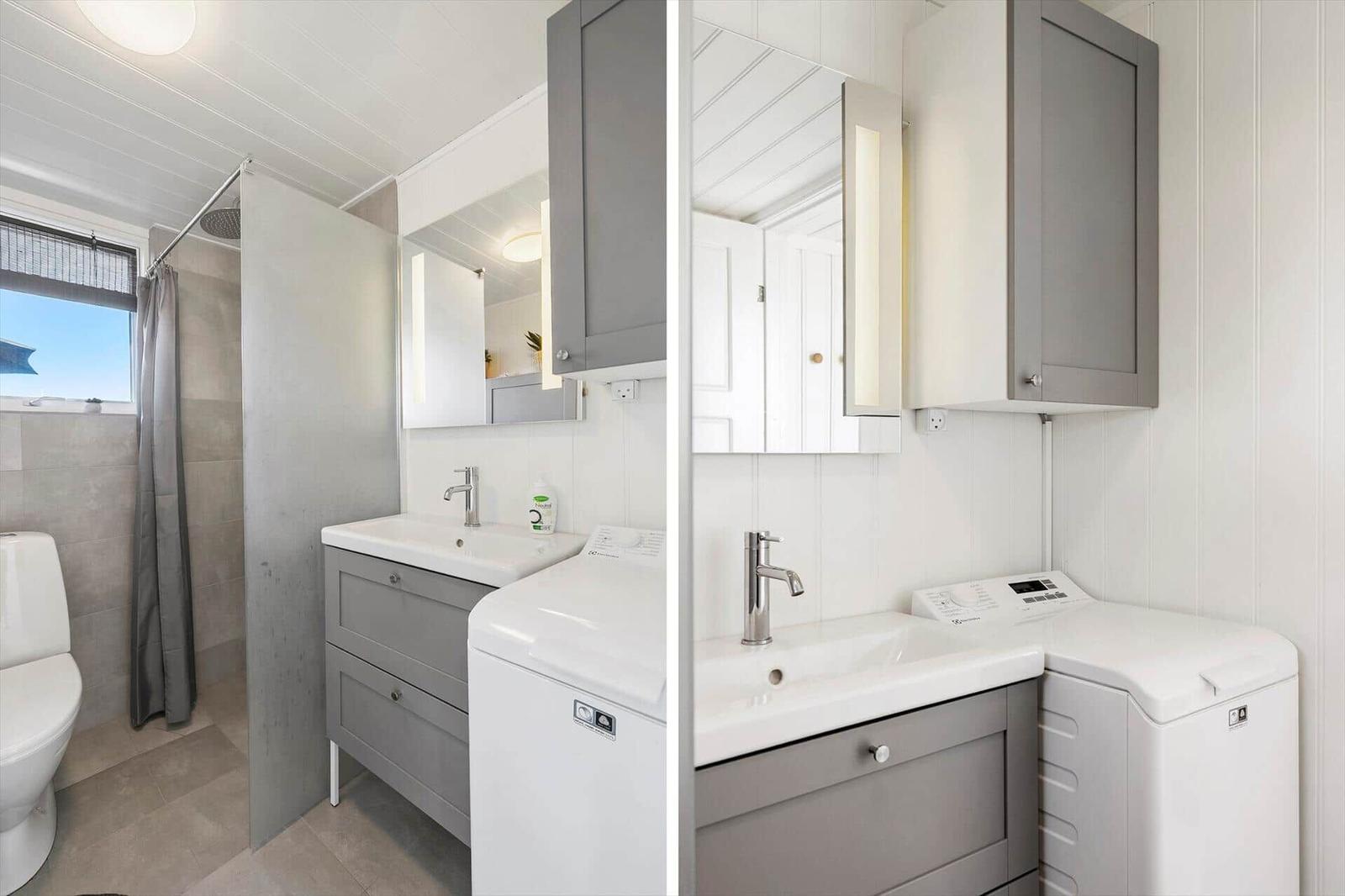 Badezimmer mit Dusche, Waschbecken und Waschmaschine