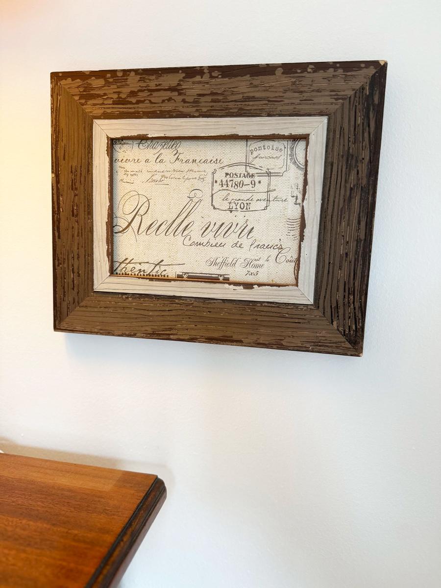 Wall art in rustic wooden frame with French postage motif