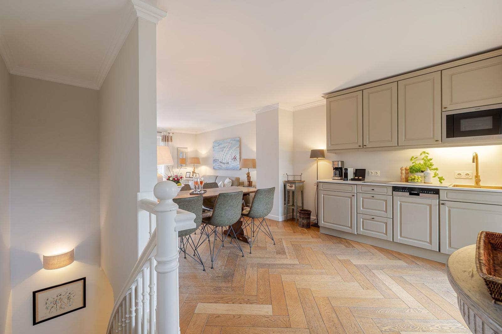 Kitchen with dining area and herringbone wood floor