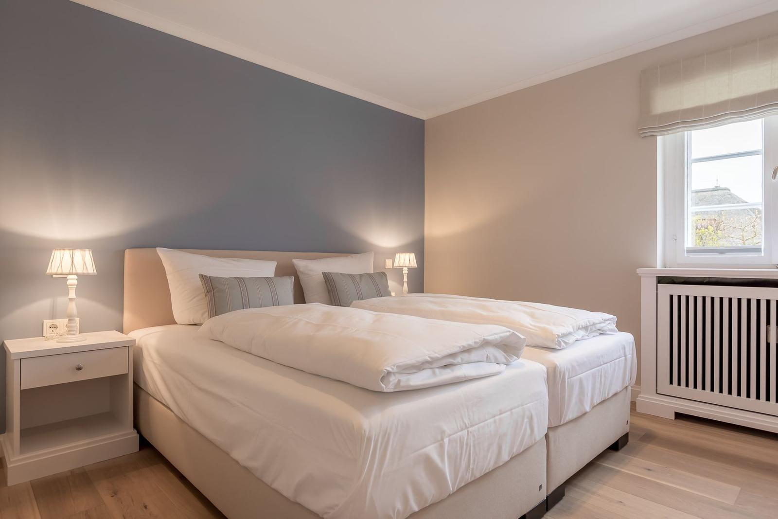 Bedroom with double bed, nightstands, and window