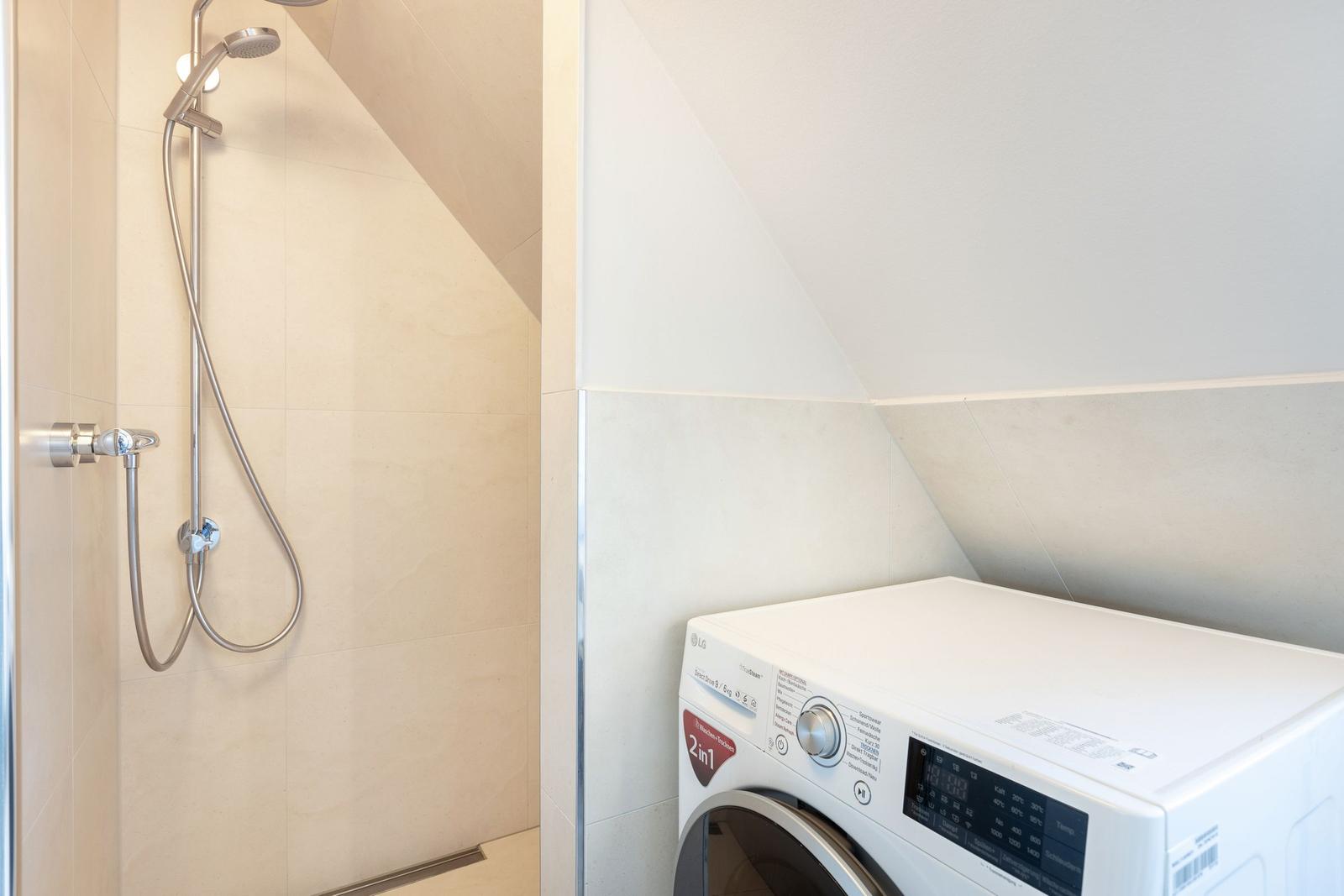 Shower and washing machine under the sloped ceiling