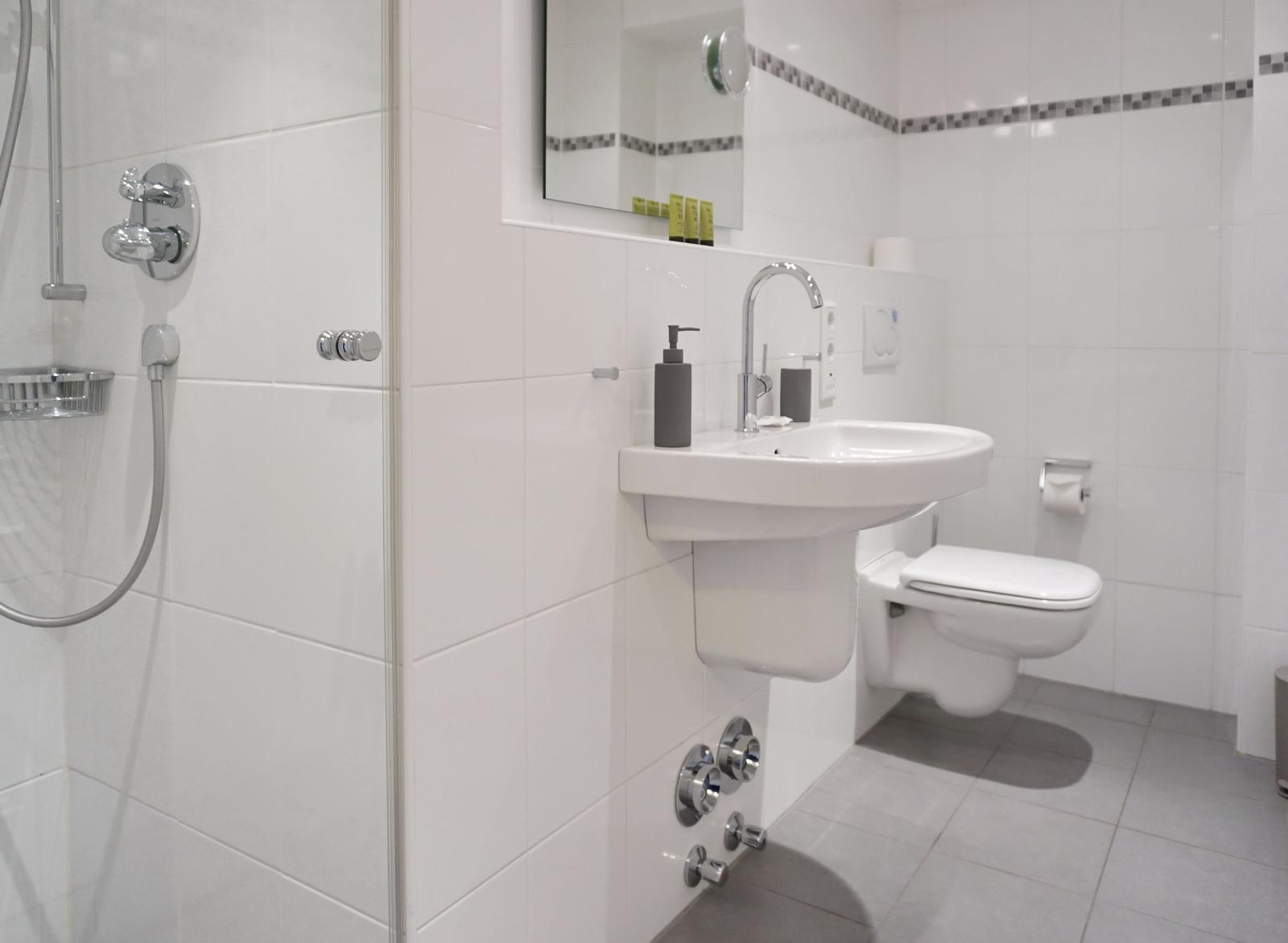 Bathroom with shower, sink and toilet