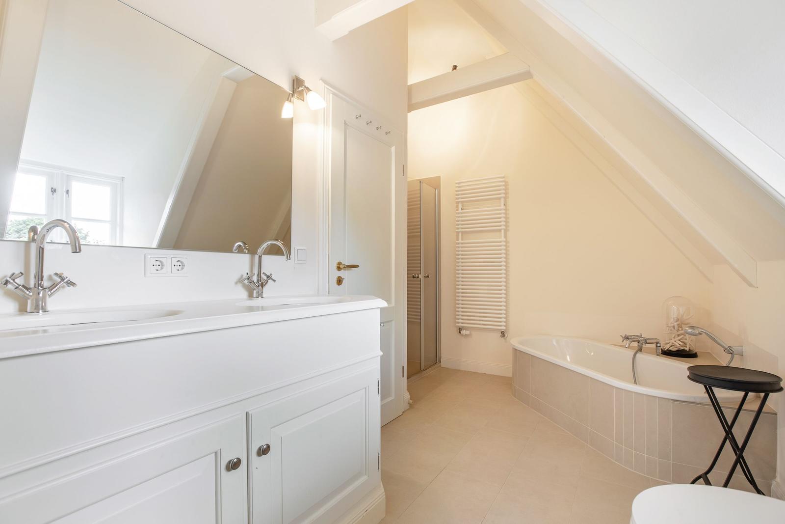 Bathroom with shower, bathtub, and mirror