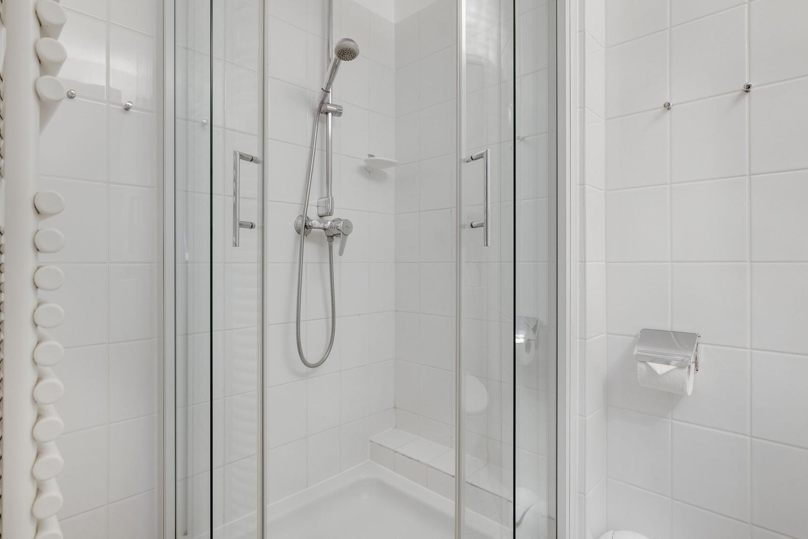 Shower cabin with glass door and showerhead