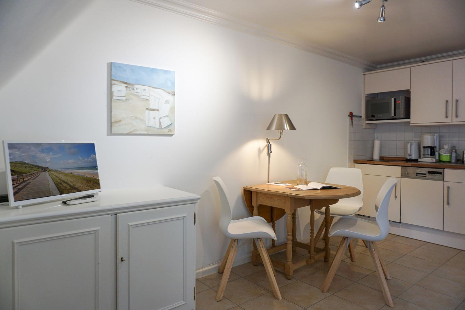 Kitchen with dining area and TV on cabinet