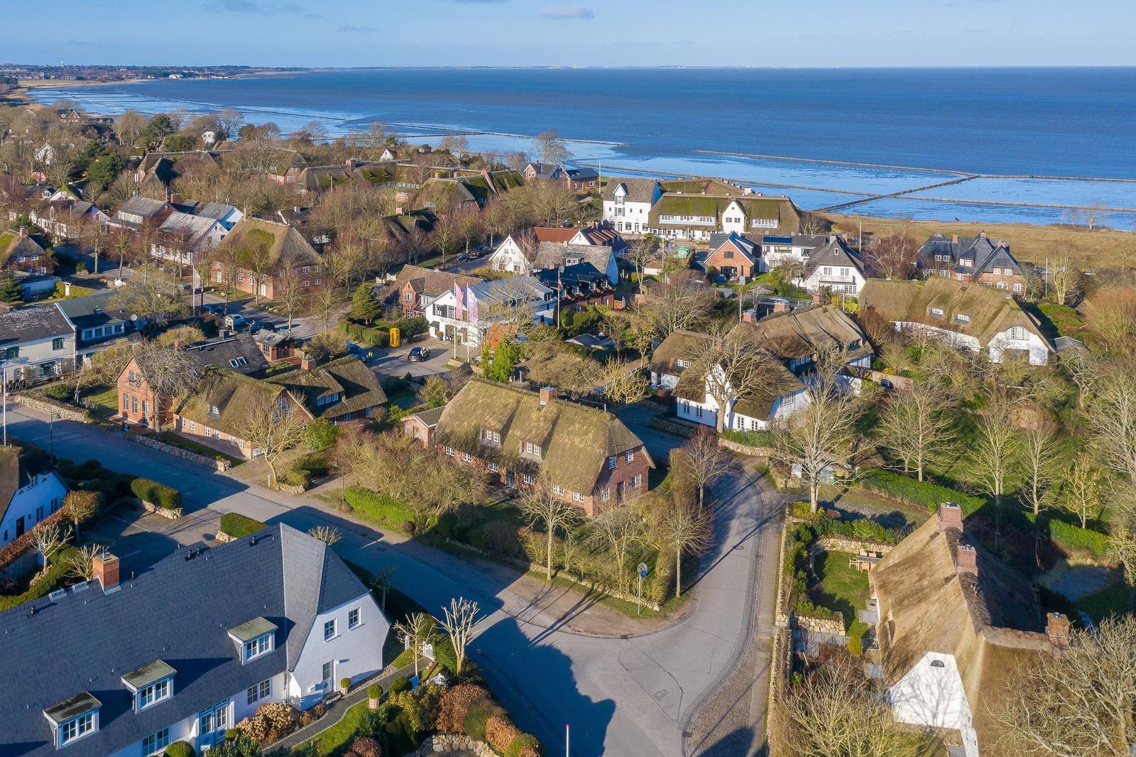 Village with thatched houses by the sea