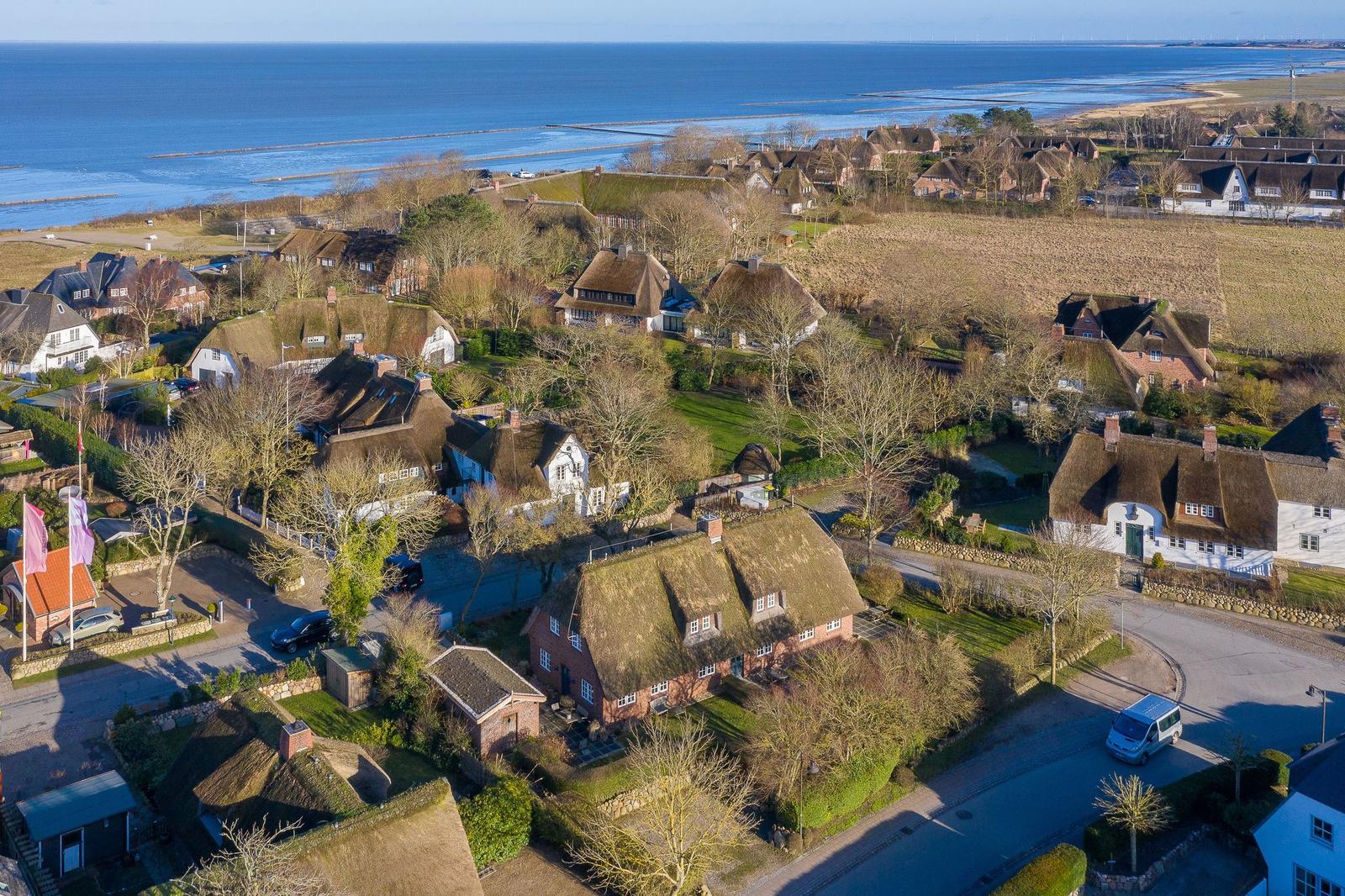 Village with thatched roofs by the sea