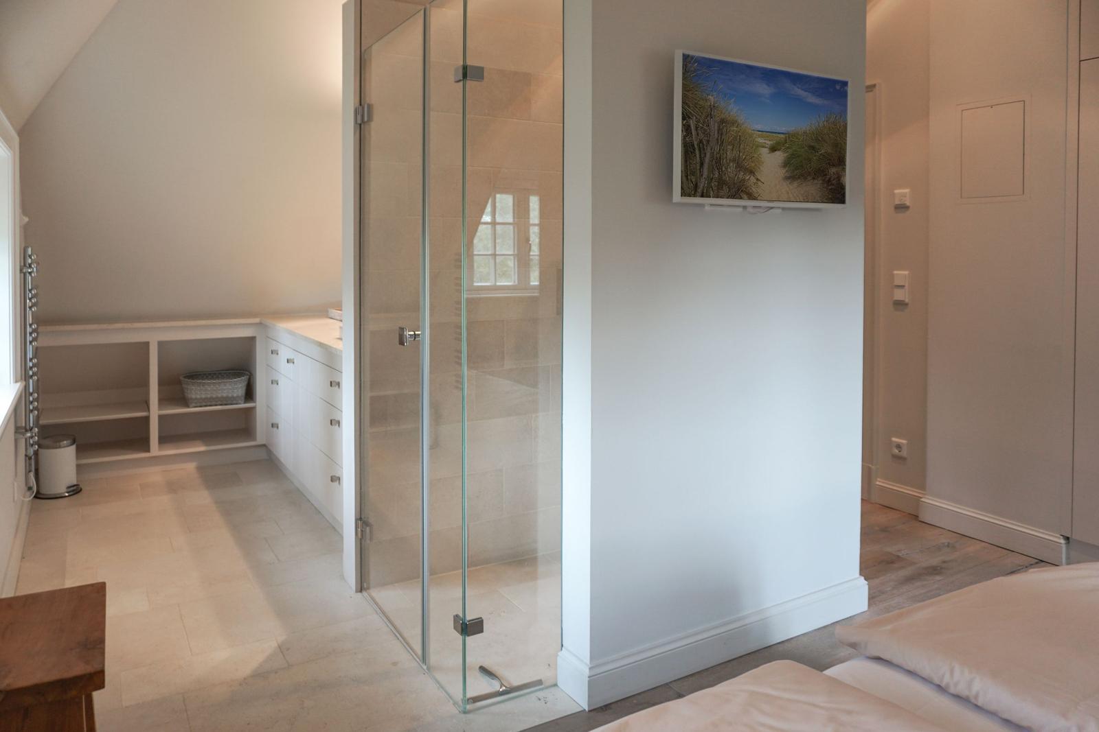 Bathroom with shower, sink and mirror cabinet