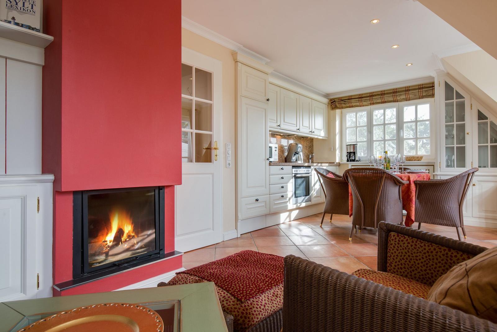 Kitchen with dining area and fireplace in living room