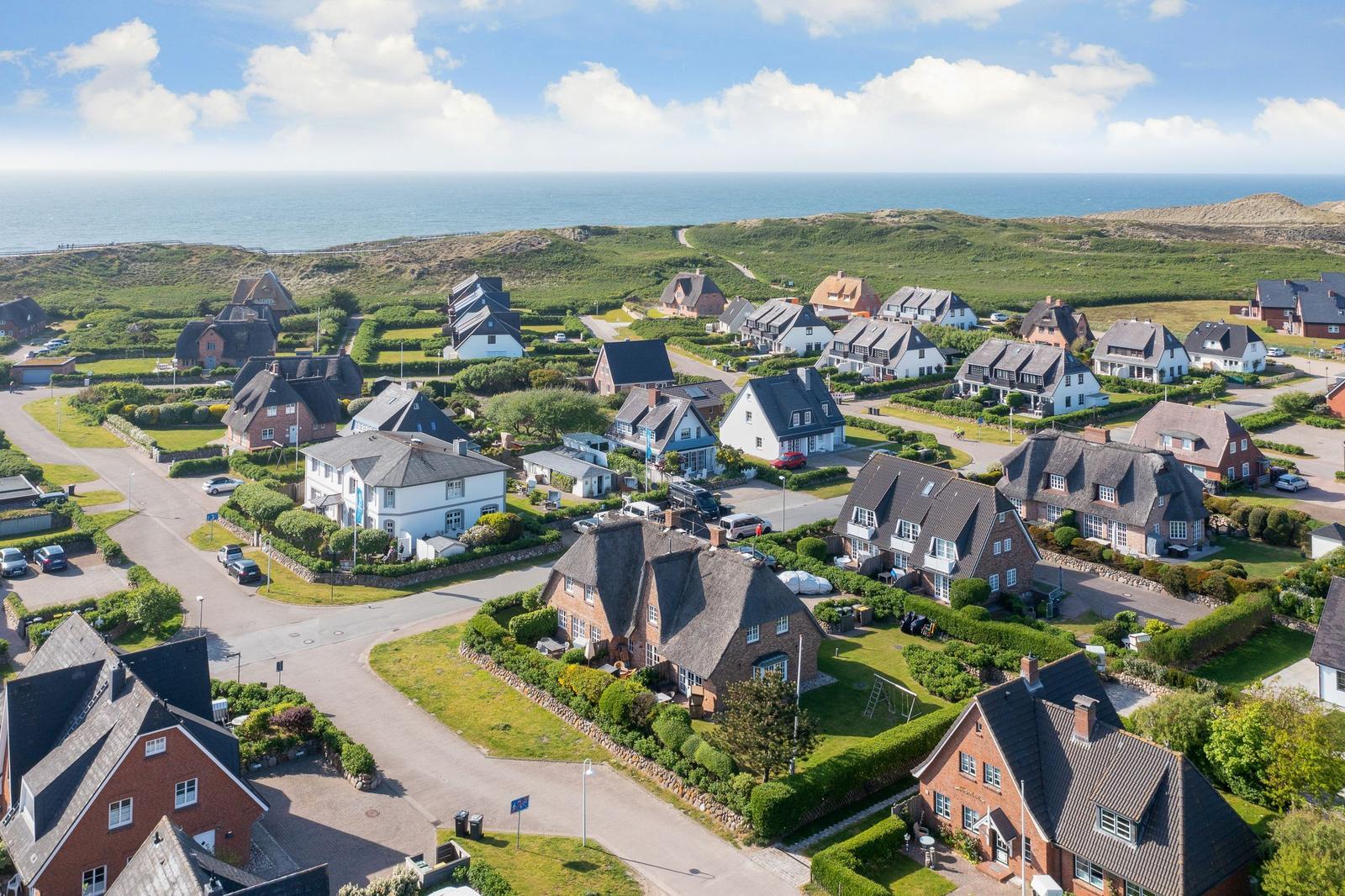 Village with houses and view of the sea