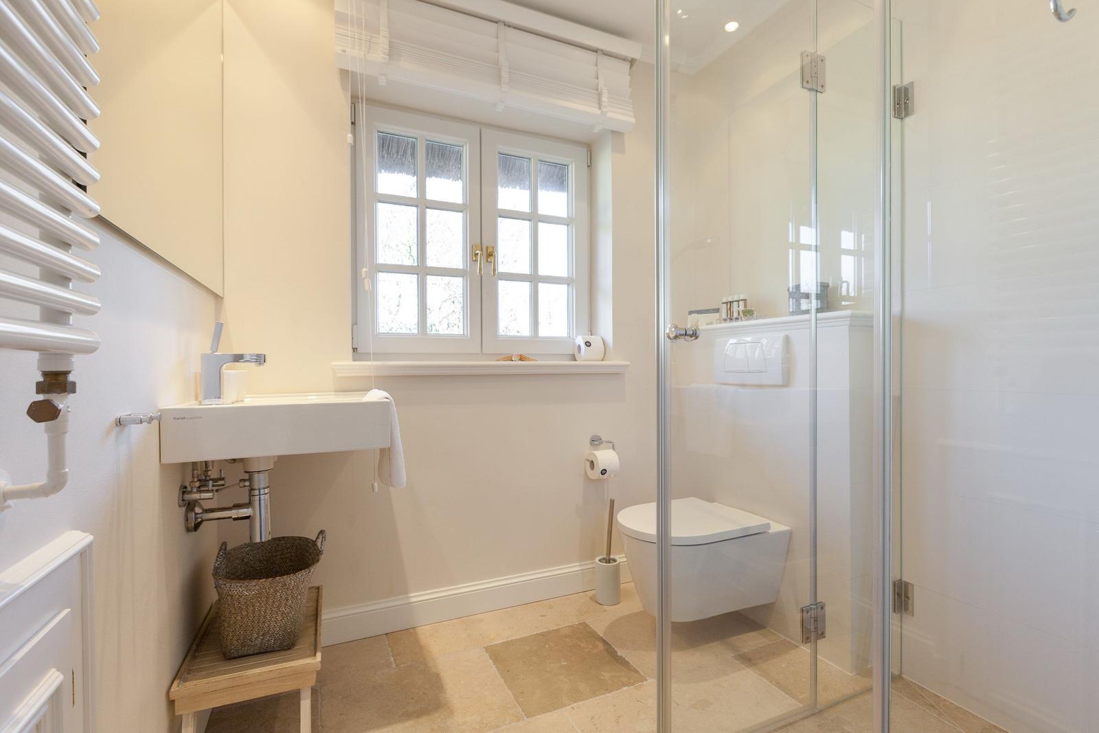 Bathroom with shower, toilet, and sink