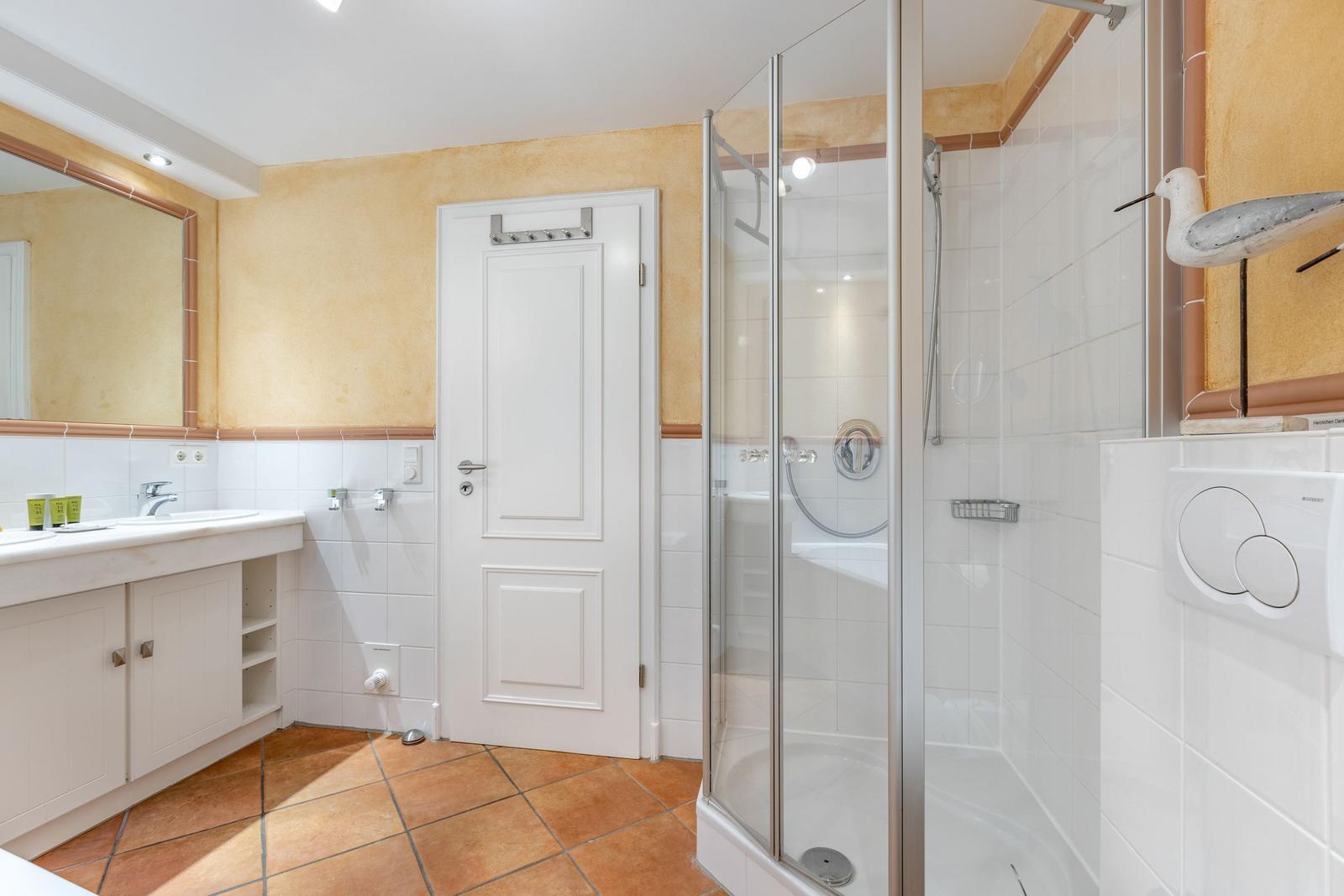 Bath with shower, sink and toilet
