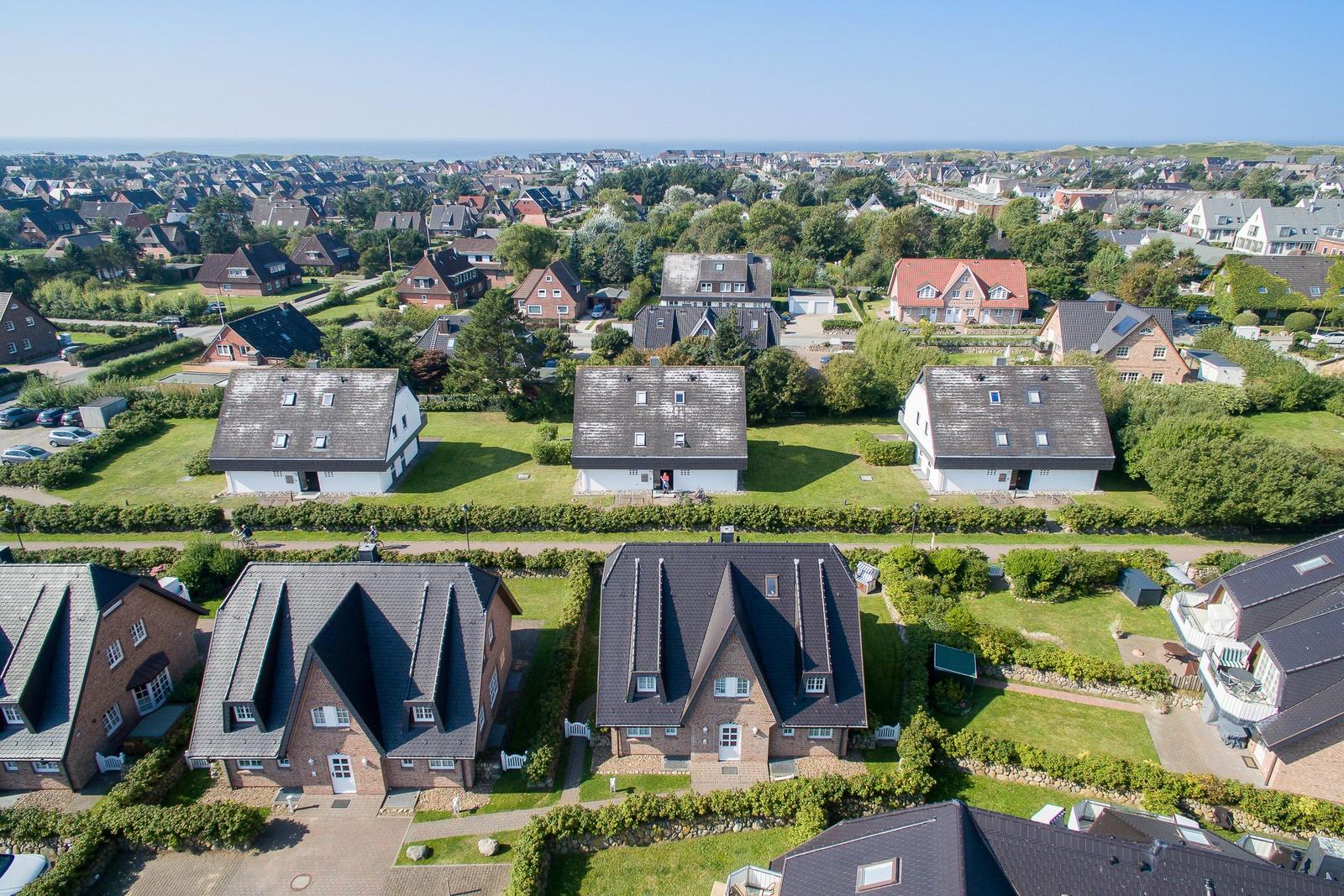 Houses with gardens and view of the coast
