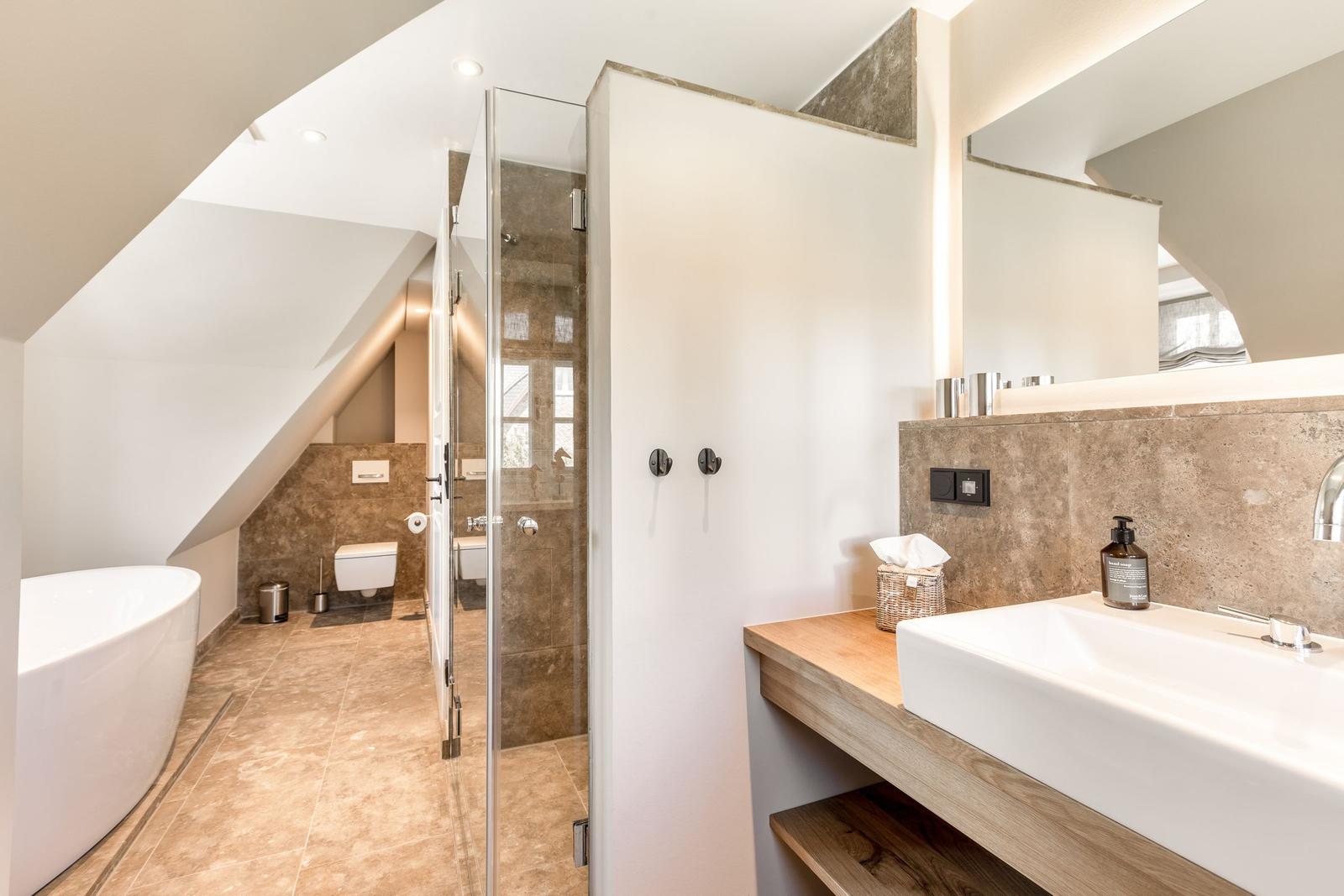Bathroom with shower, bathtub, and sink.