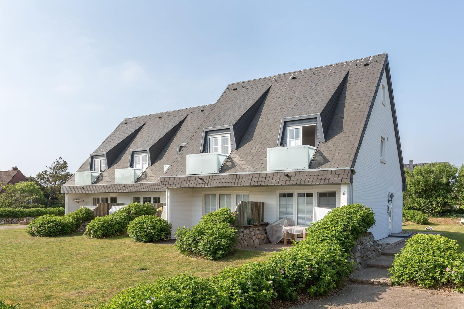 House with roof terraces and green surroundings