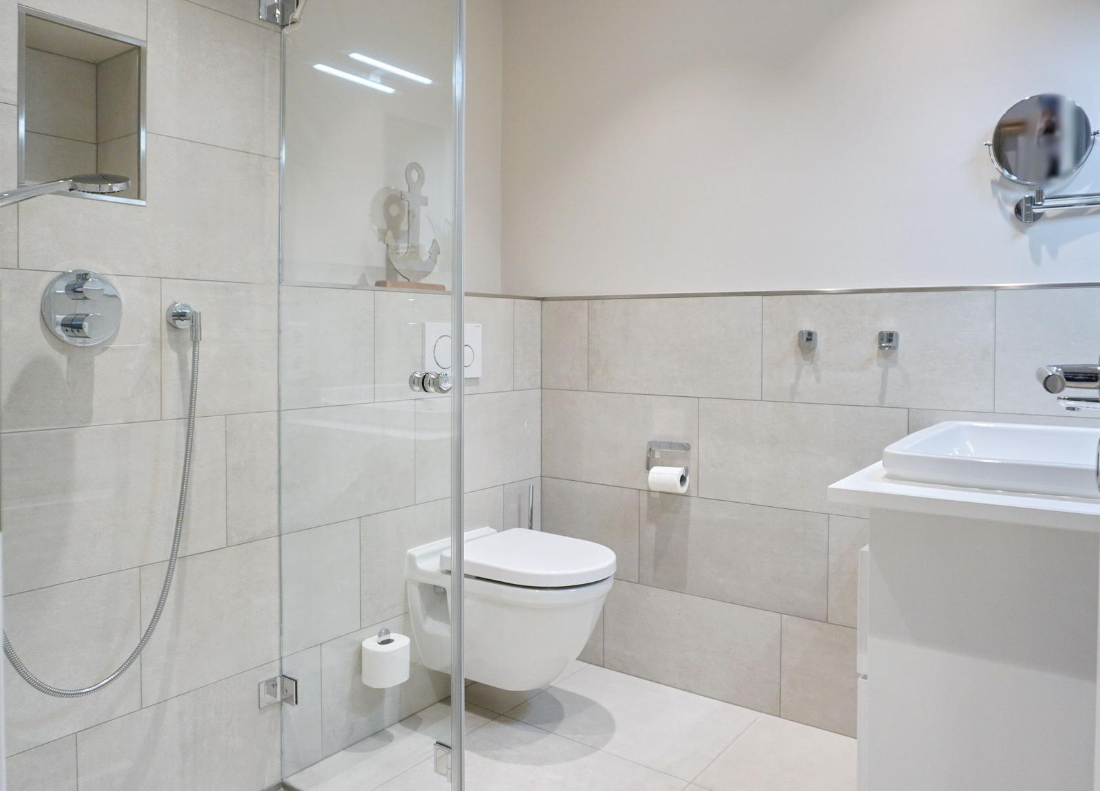 Bathroom with shower, toilet, and sink