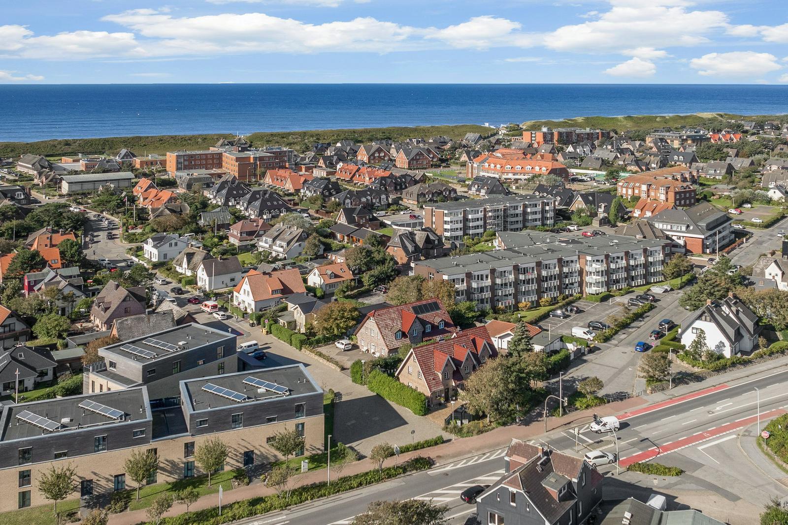 Panoramic view of coastal town with houses and sea