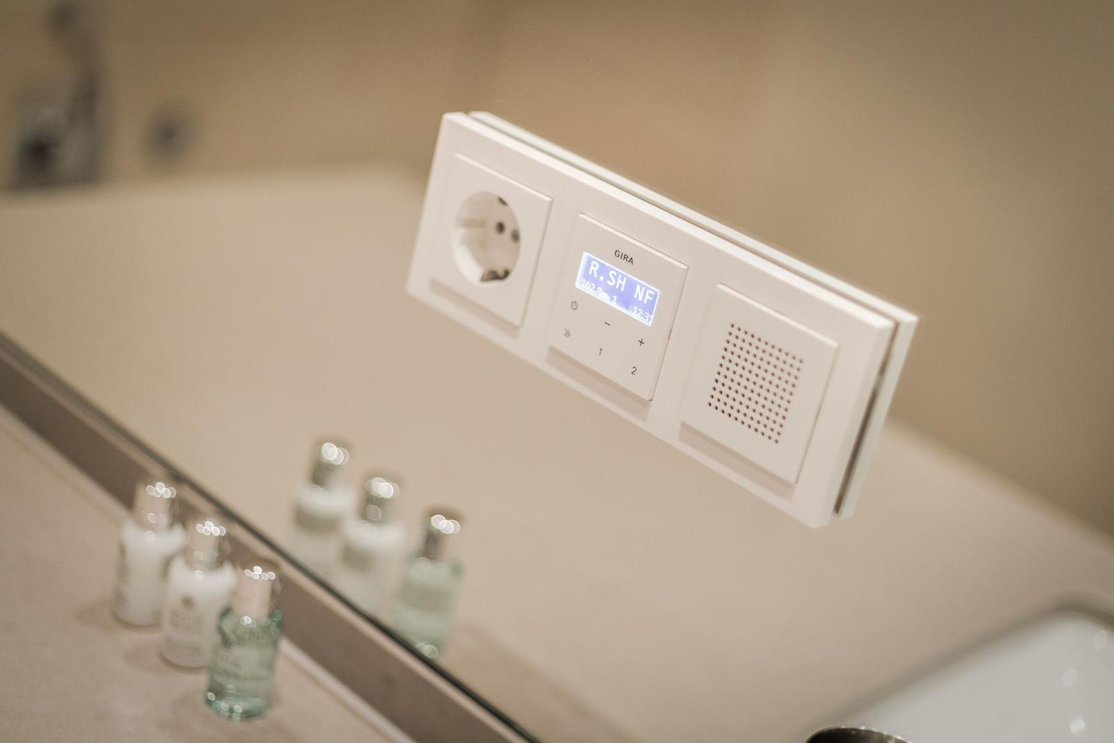 Shower cabin with modern control panel and mirror cabinet