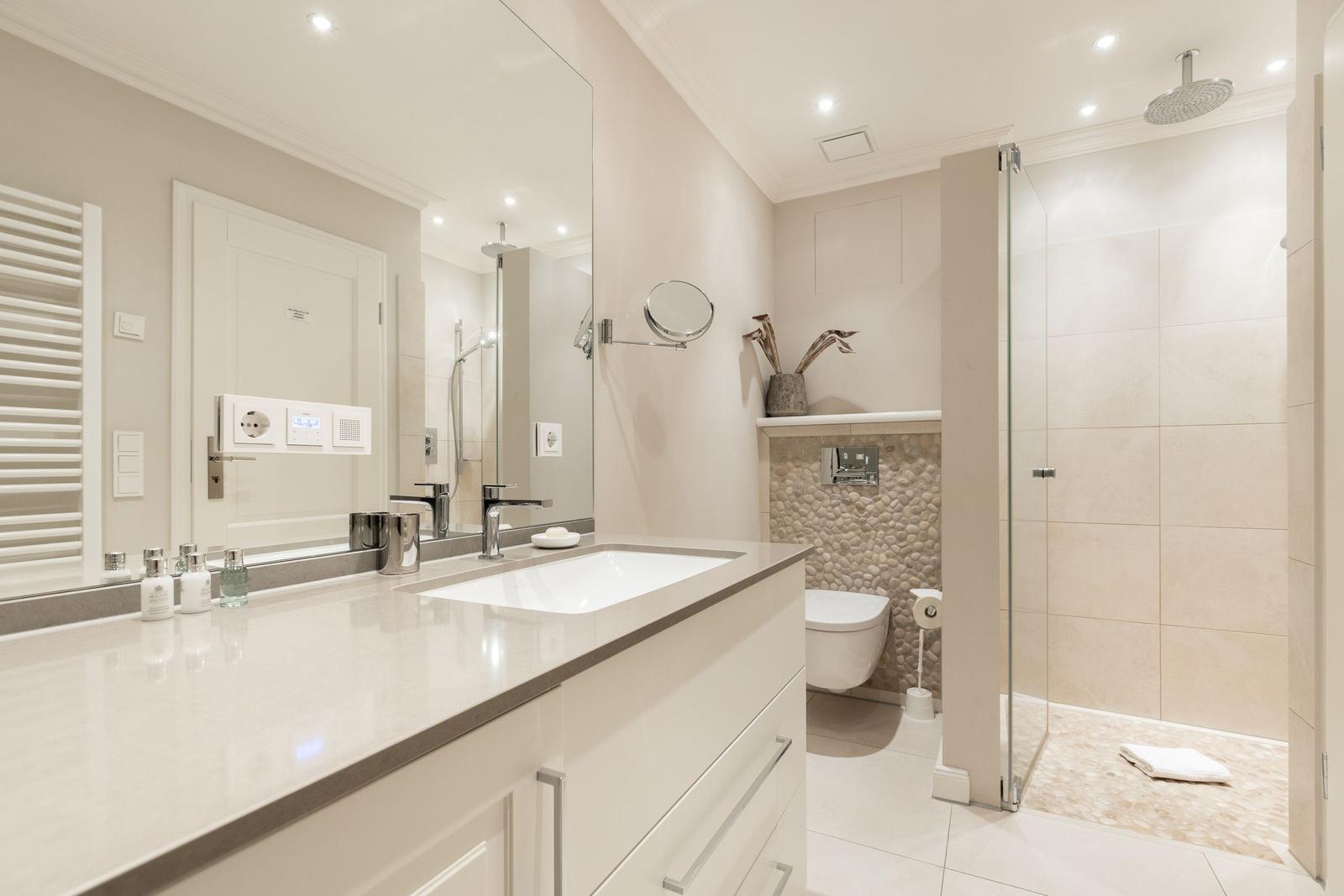Bathroom with shower, sink, and toilet