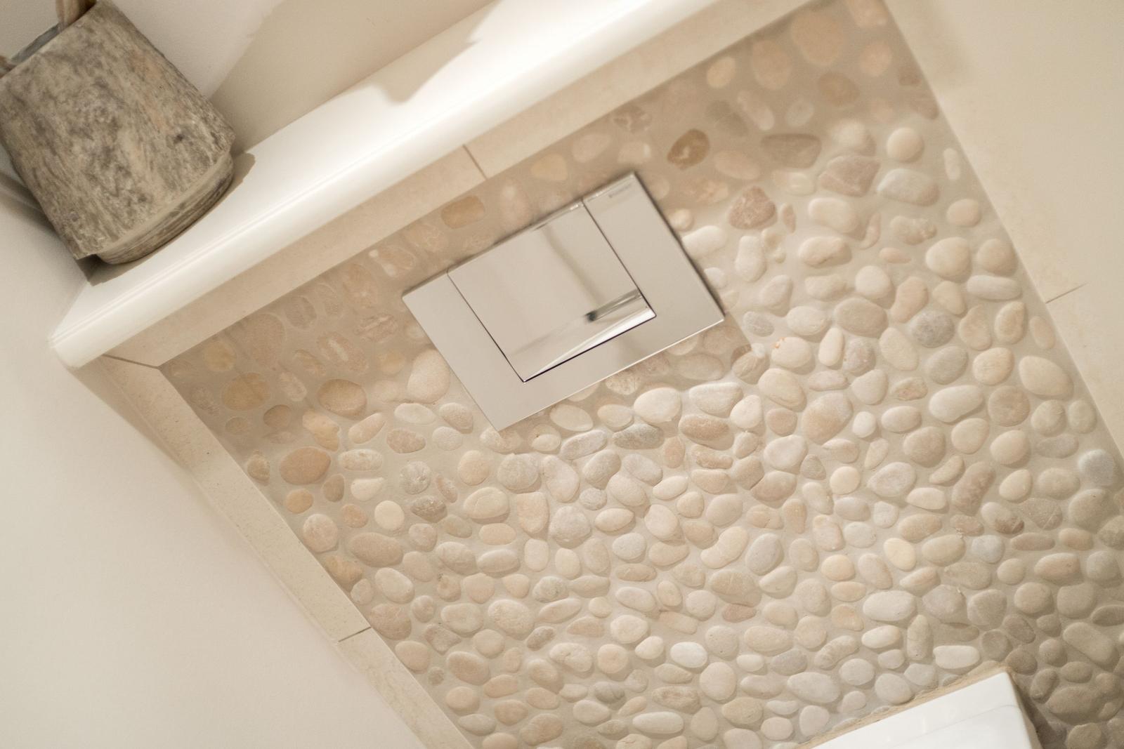 Shower with stone tiles and modern shower area