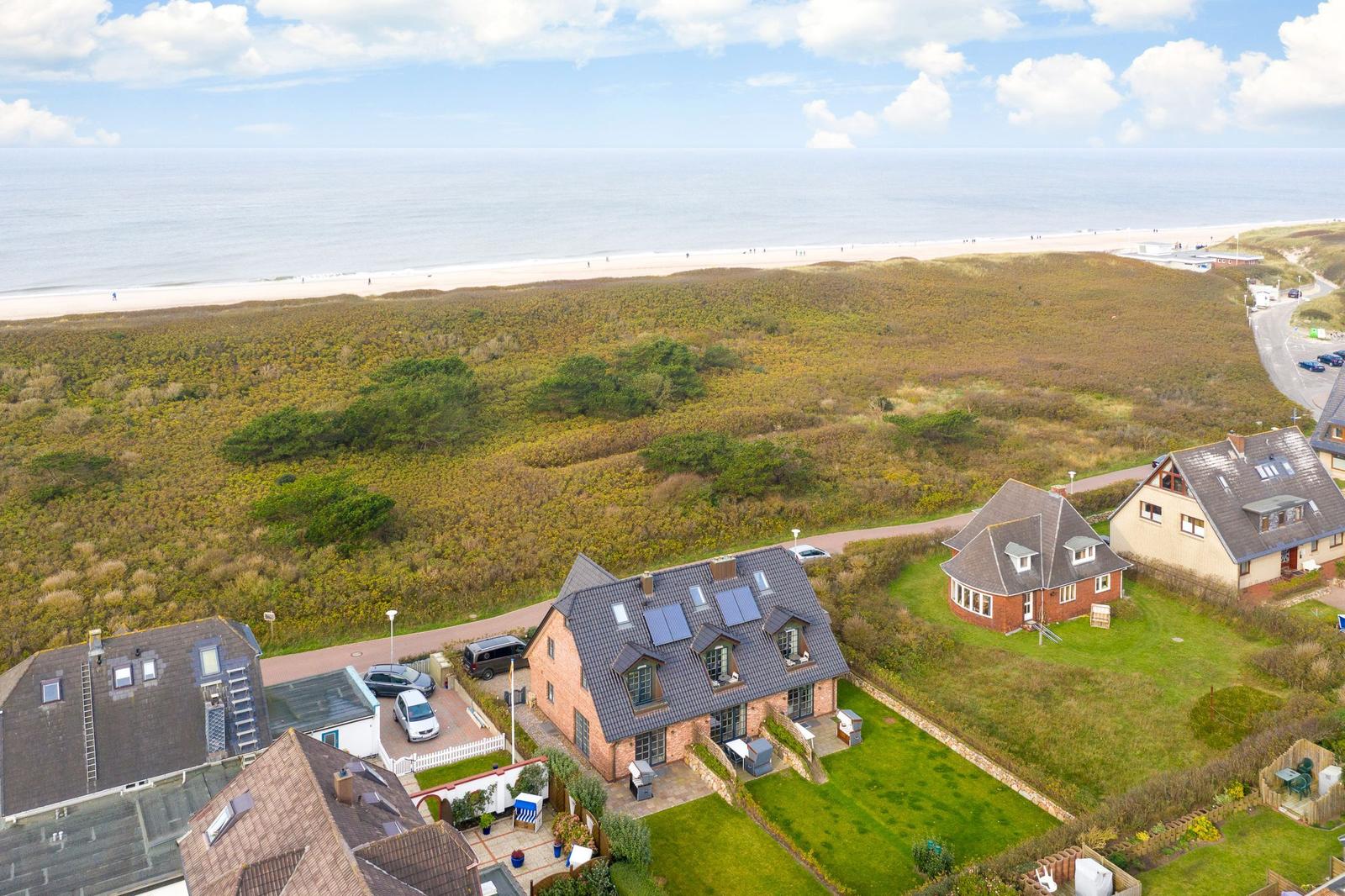 House with garden and view of beach and sea