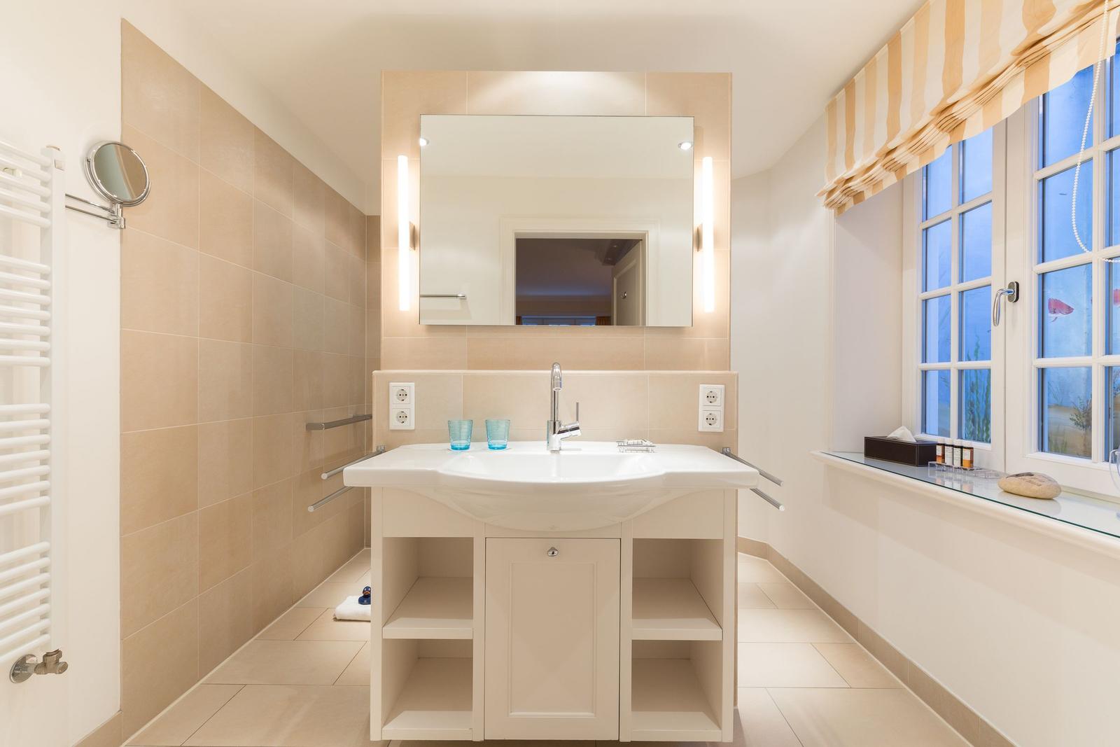 Bathroom with sink, mirror and window