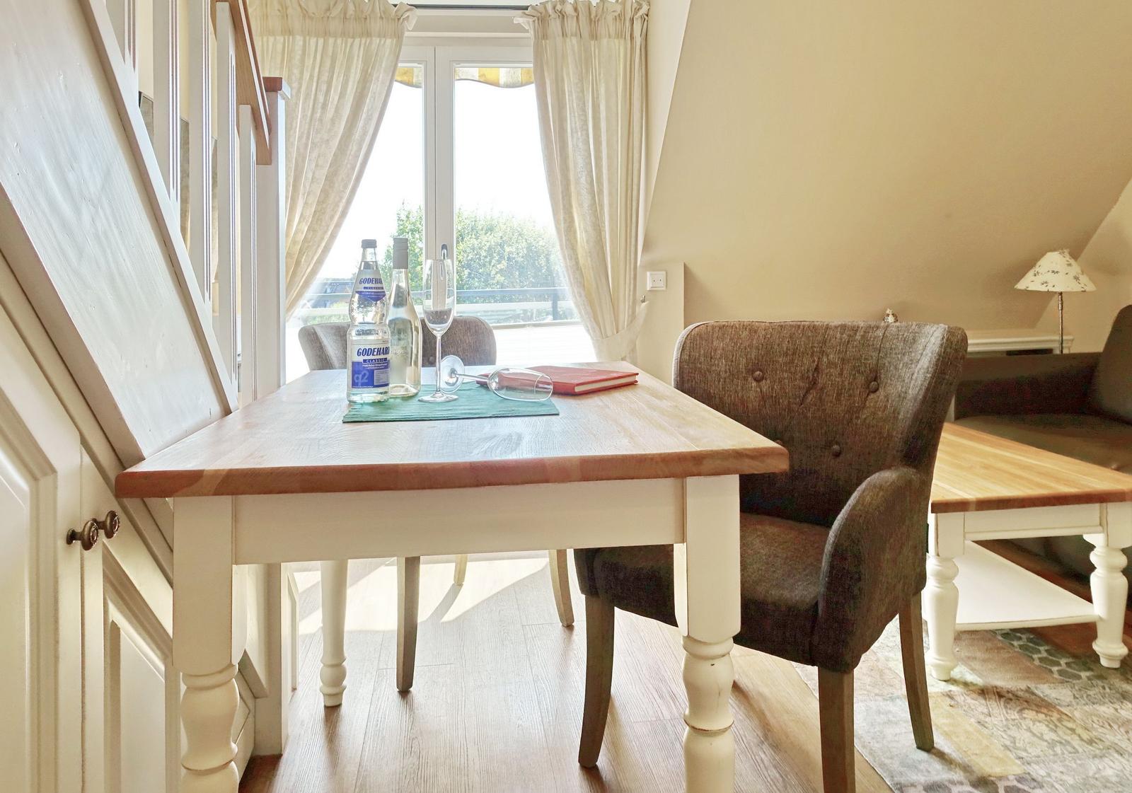 Dining table with chairs and window view