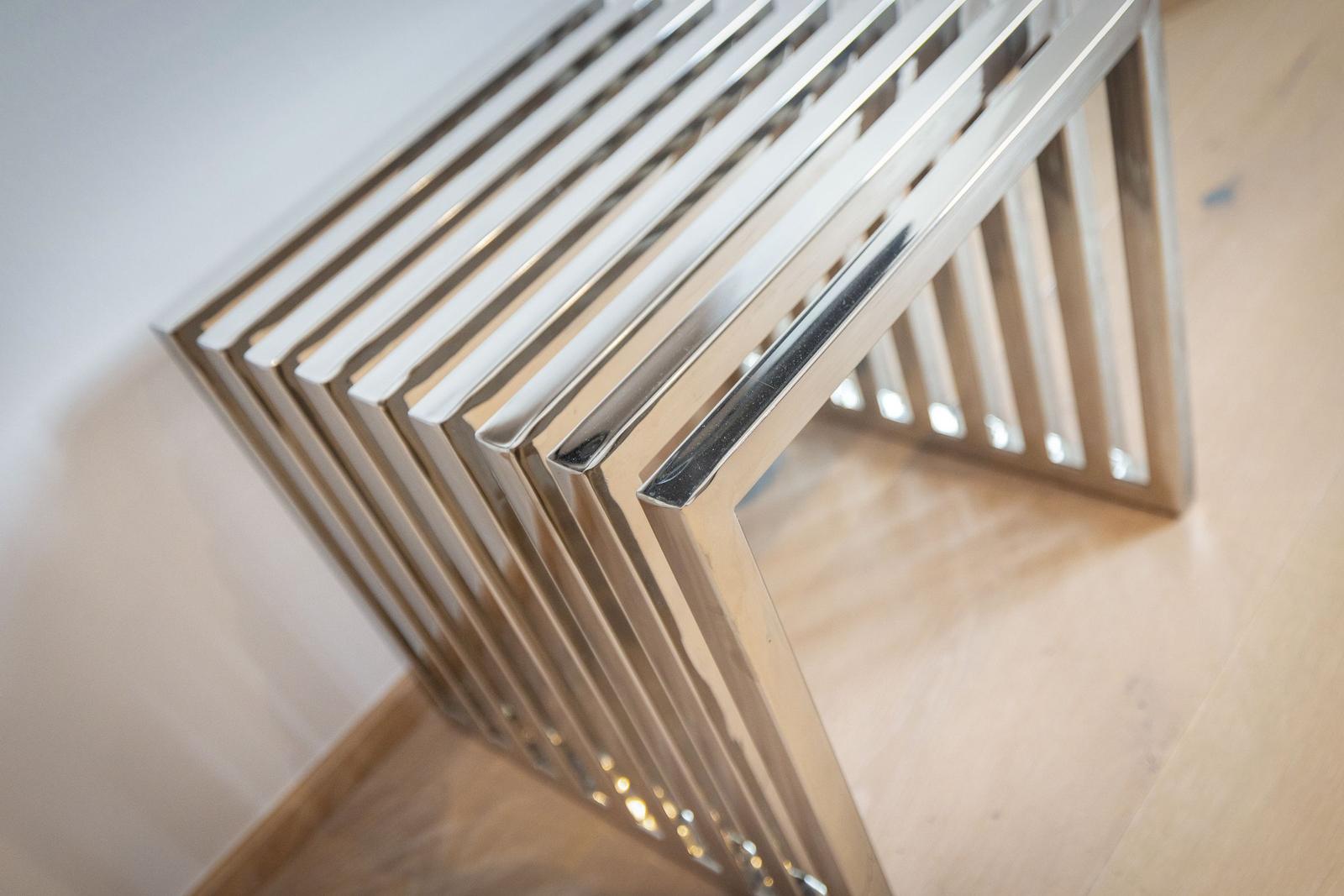 Metal radiator with horizontal bars mounted on wall