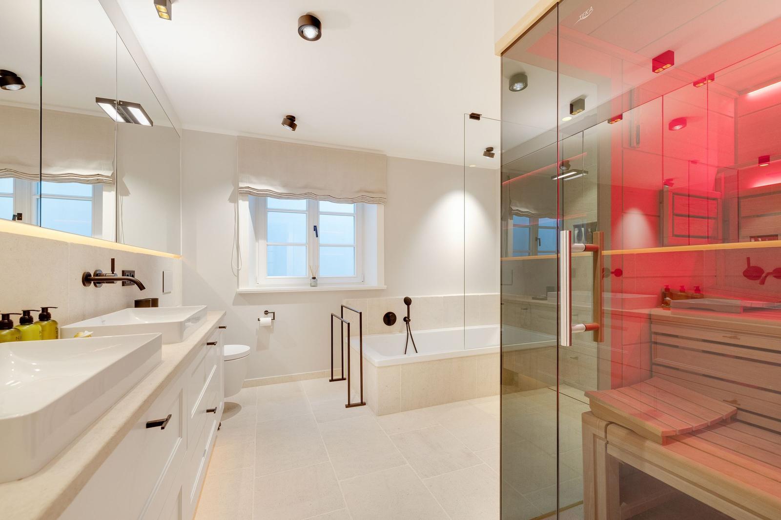 Bathroom with shower, bathtub, and sauna.